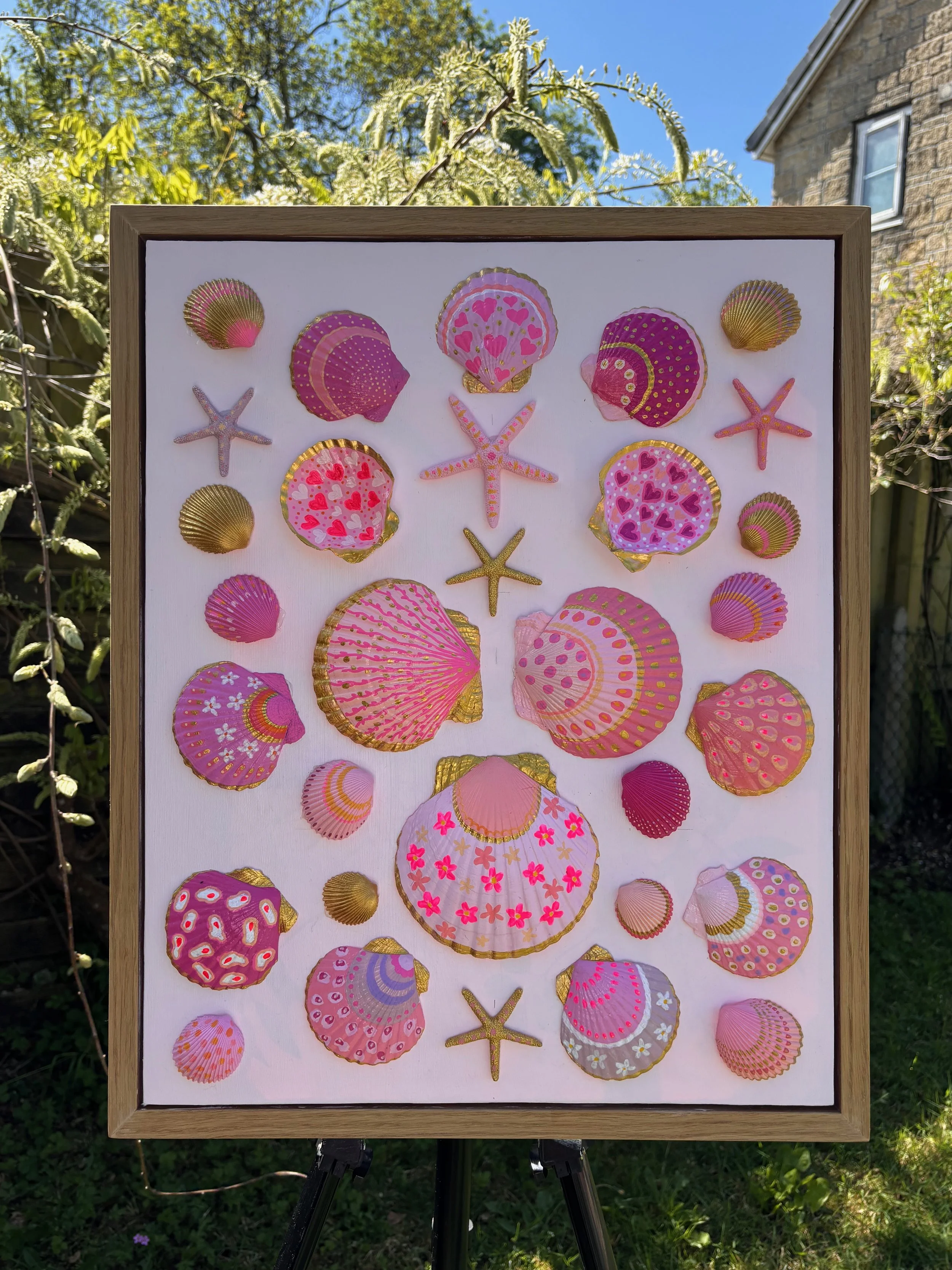 Pink and gold shell wall art with hand painted seashells and starfish