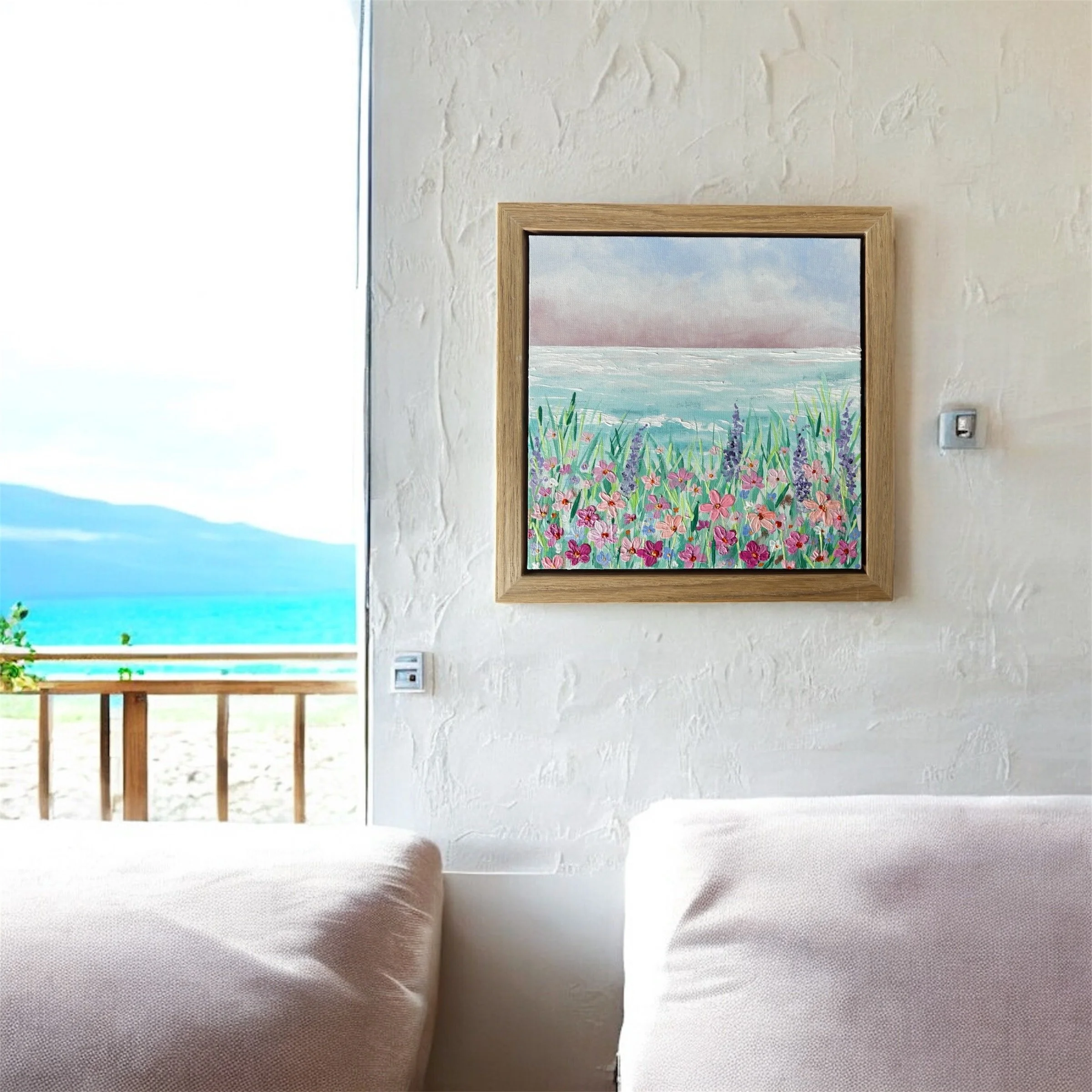 Alt Text Seascape I original coastal landscape painting with soft pink skies turquoise ocean and wild meadow flowers in oak veneer frame