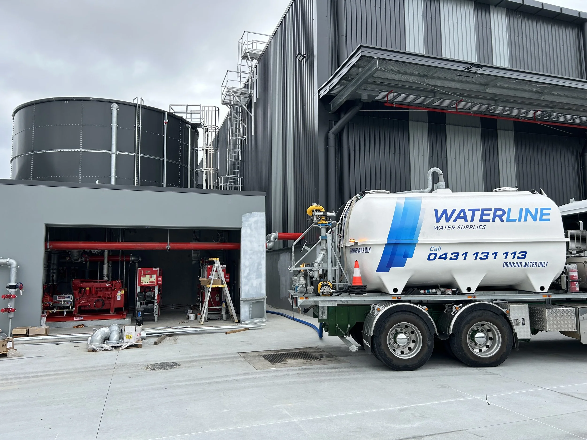Water truck delivering bulk water to a construction site on the Gold Coast