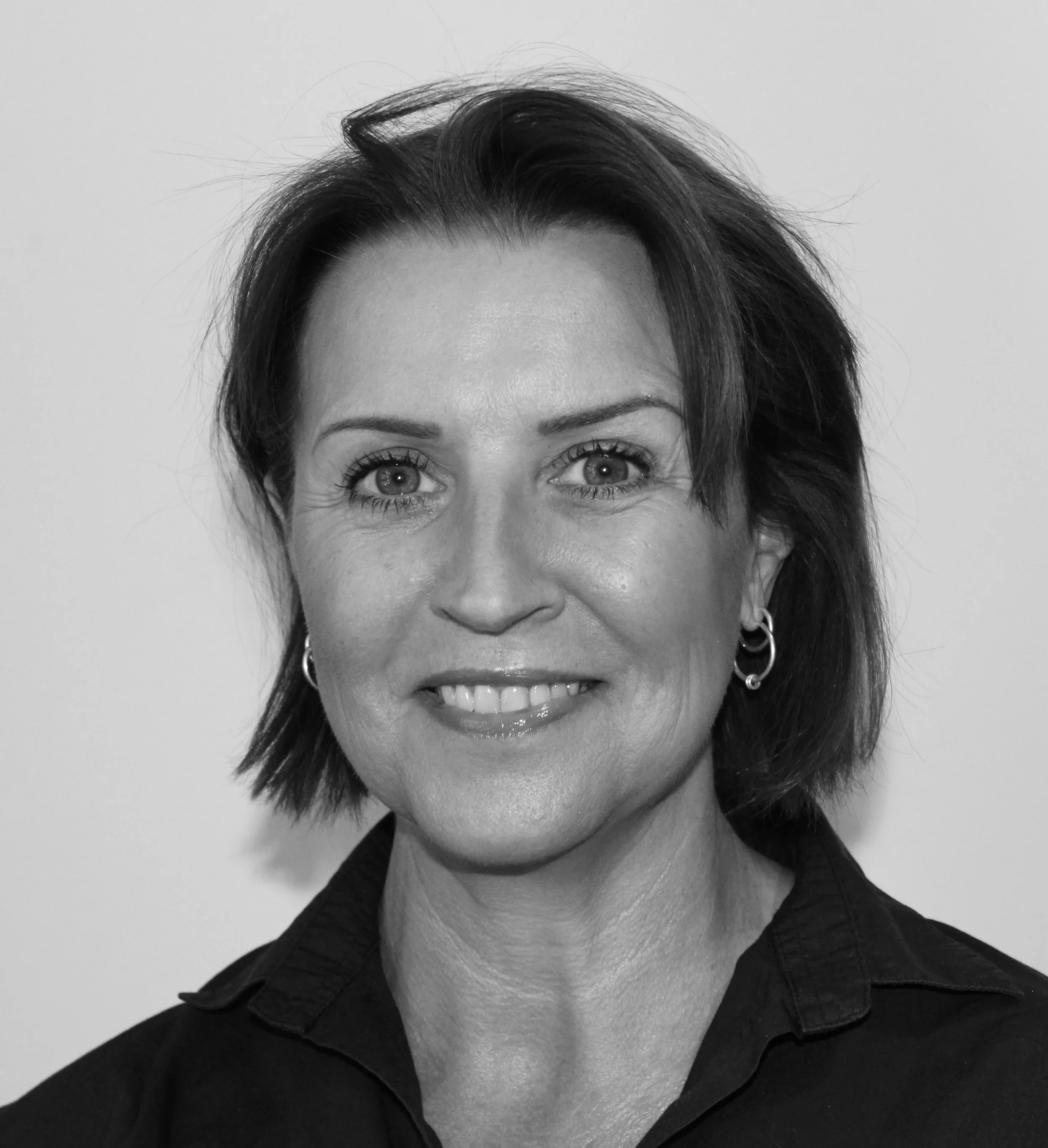 Close-up black-and-white photo of Cheryl Anson, founder of Anson Commercial