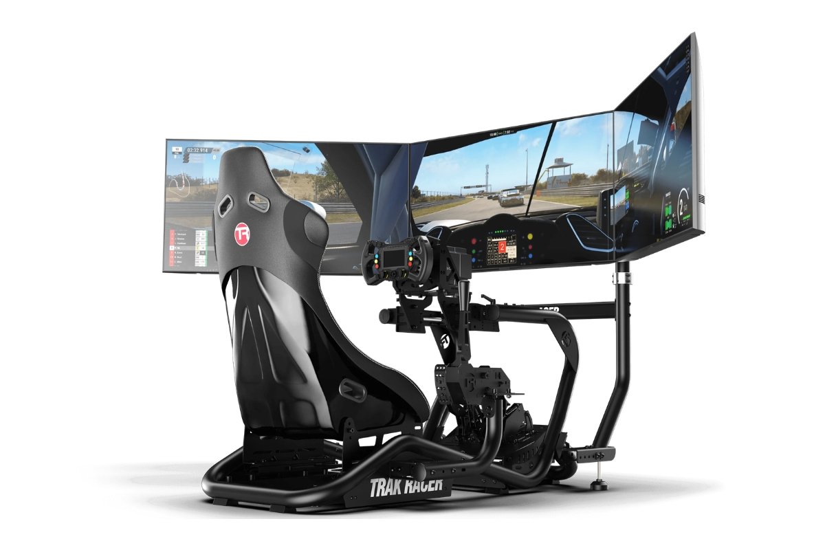 A professional racing simulator setup with a racing seat, steering wheel, pedals, and large curved monitors displaying a racing game.