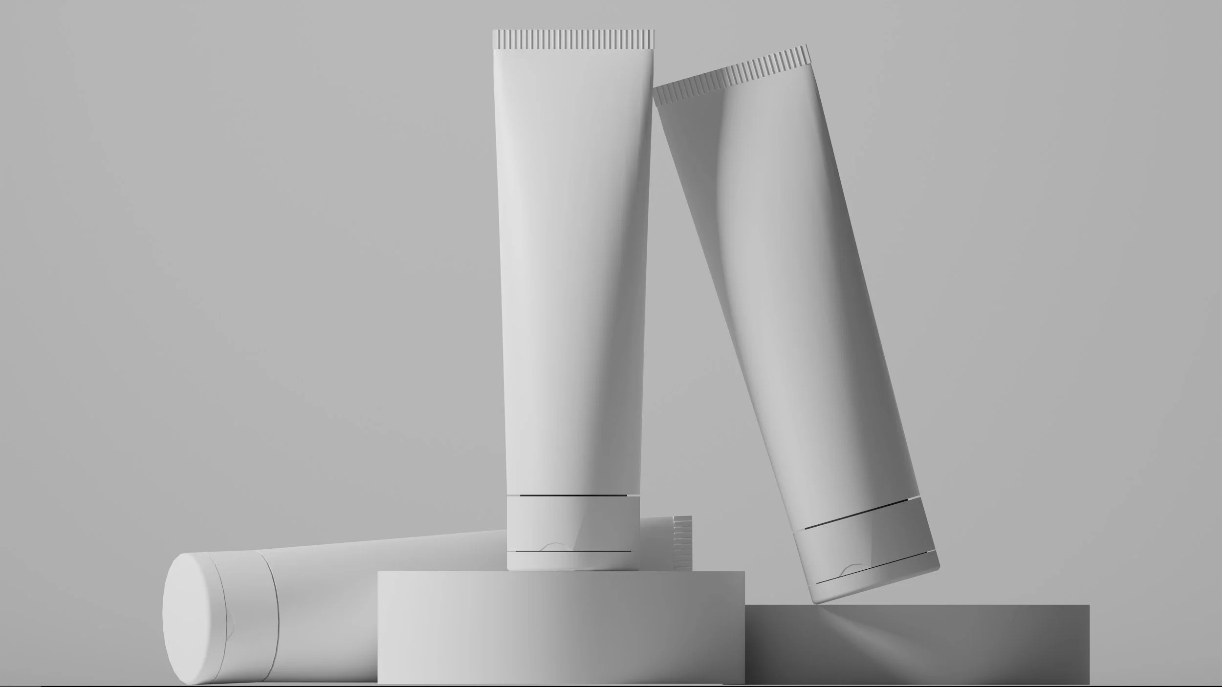 White tubes and pipes arranged in a geometric pattern on a gray background.
