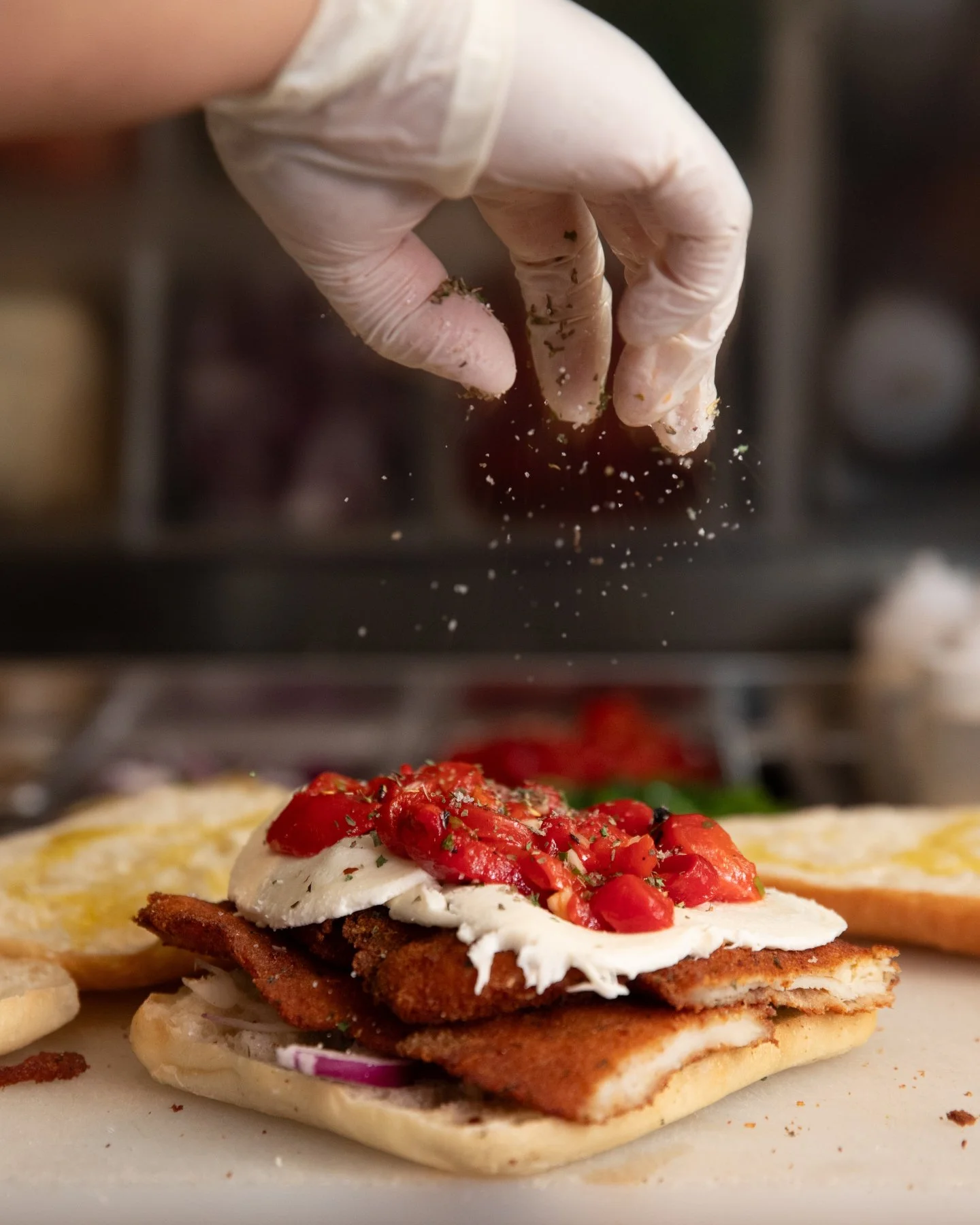 The details make the panino.

Crispy chicken cutlet, fresh mozzarella, roasted peppers, and that final touch before the press. Layered with care, made to crave, and ready when you are.

Order your panino today at labottegagourmet.com