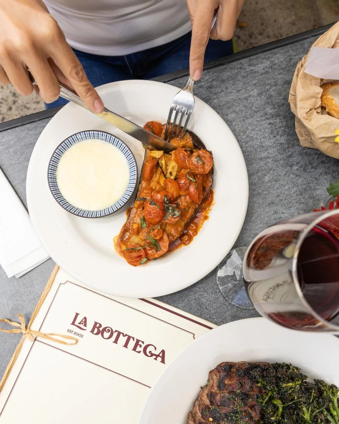 Oven roasted eggplant, cherry tomatoes and a Parmigiano Reggiano sauce. Inspired by the flavors and traditions of Italy.