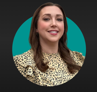 A woman with long, wavy brown hair smiling in front of a teal circle background, wearing a leopard print top with ruffled shoulders.