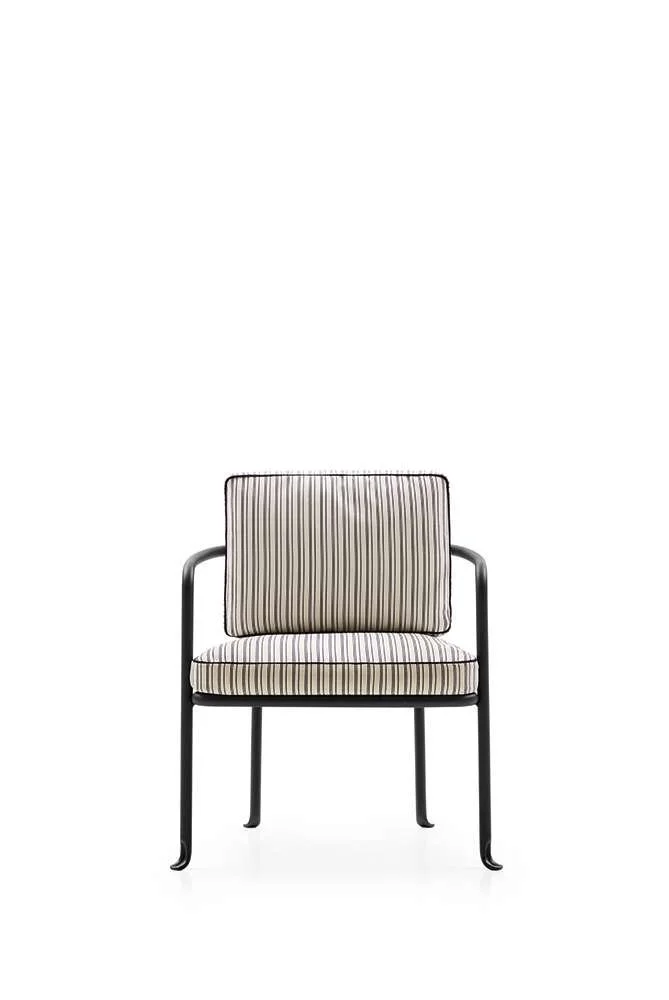 A modern armchair with black metal frame and beige striped cushions.