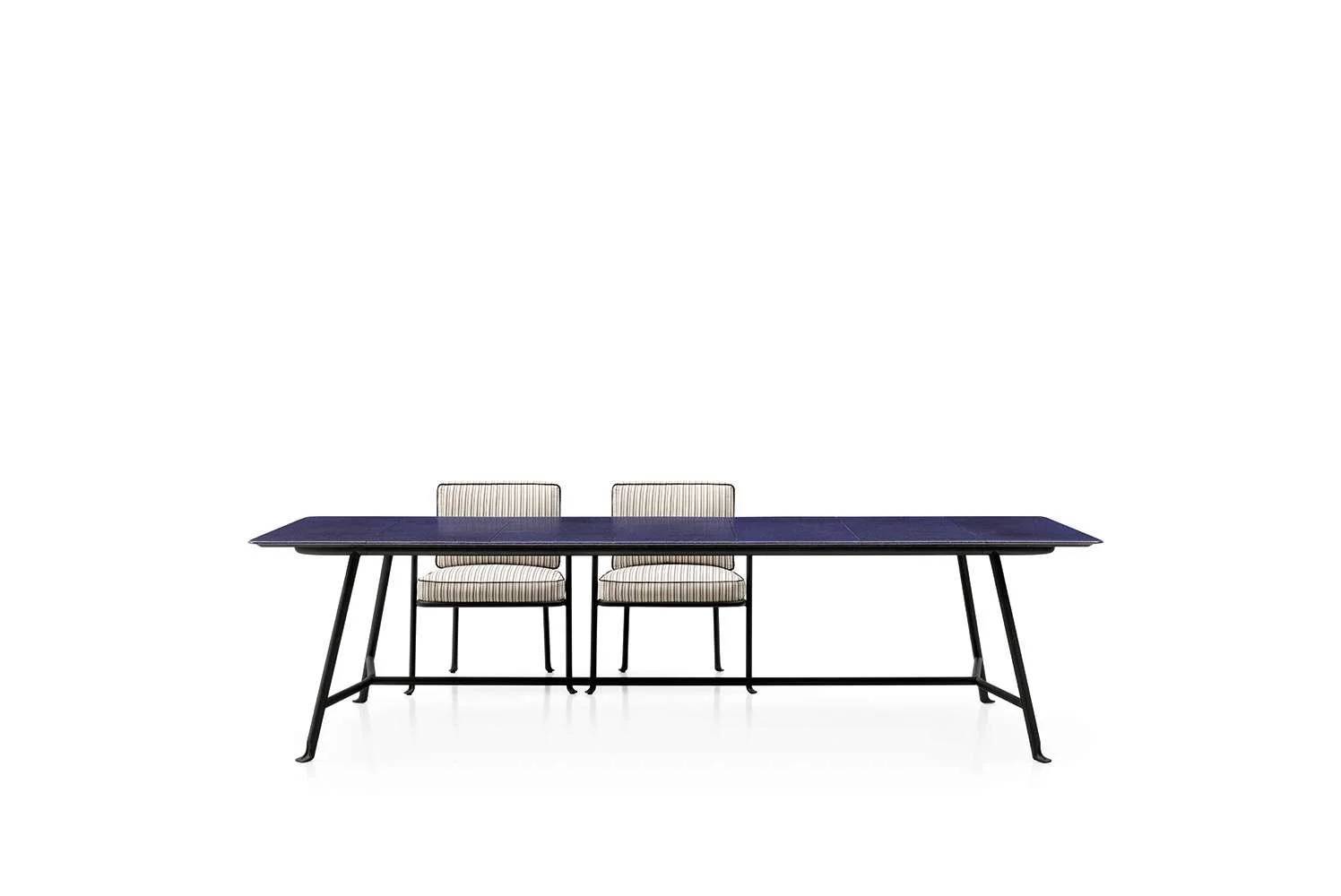 A modern dining table with a dark blue surface and black metal legs, accompanied by two striped cushioned chairs with black legs, set against a plain white background.