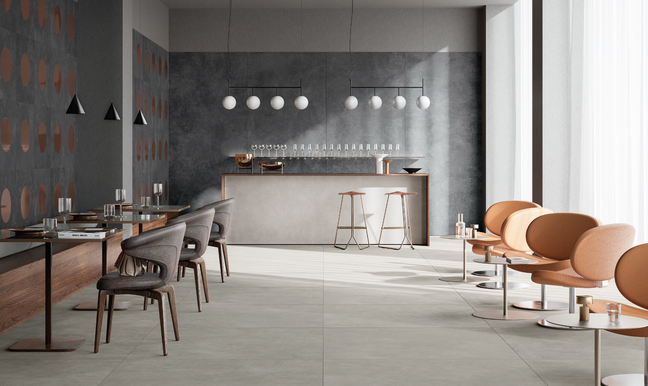 Modern restaurant interior with gray and tan chairs, a bar with glasses, and hanging white globe light fixtures.