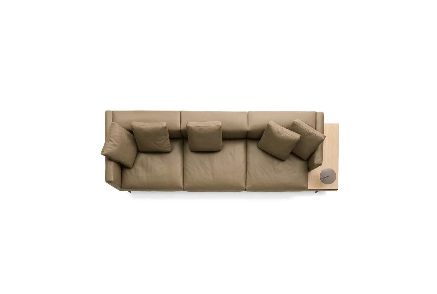 Top-down view of a beige sofa with five matching cushions and a wooden side table with a circular gray object on top, set against a white background.