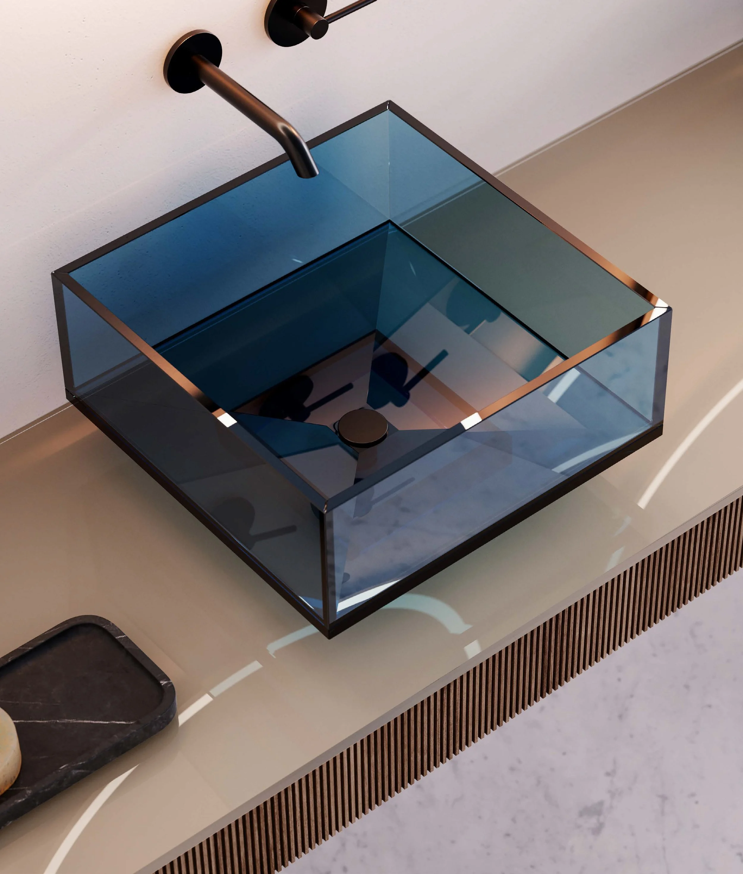A stylish black square-shaped soap dispenser and a matching black faucet mounted above a glass basin with a reflective surface, situated on a white countertop with a wood slatted front panel.