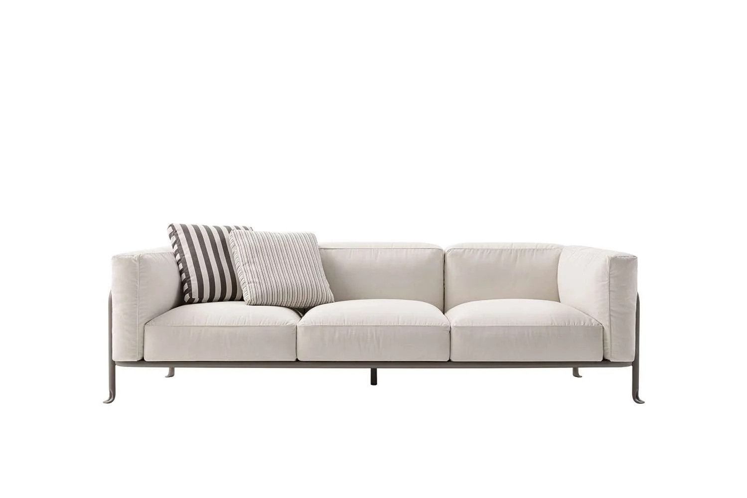 A white modern sofa with three cushions, two striped and one plain, against a plain white background.