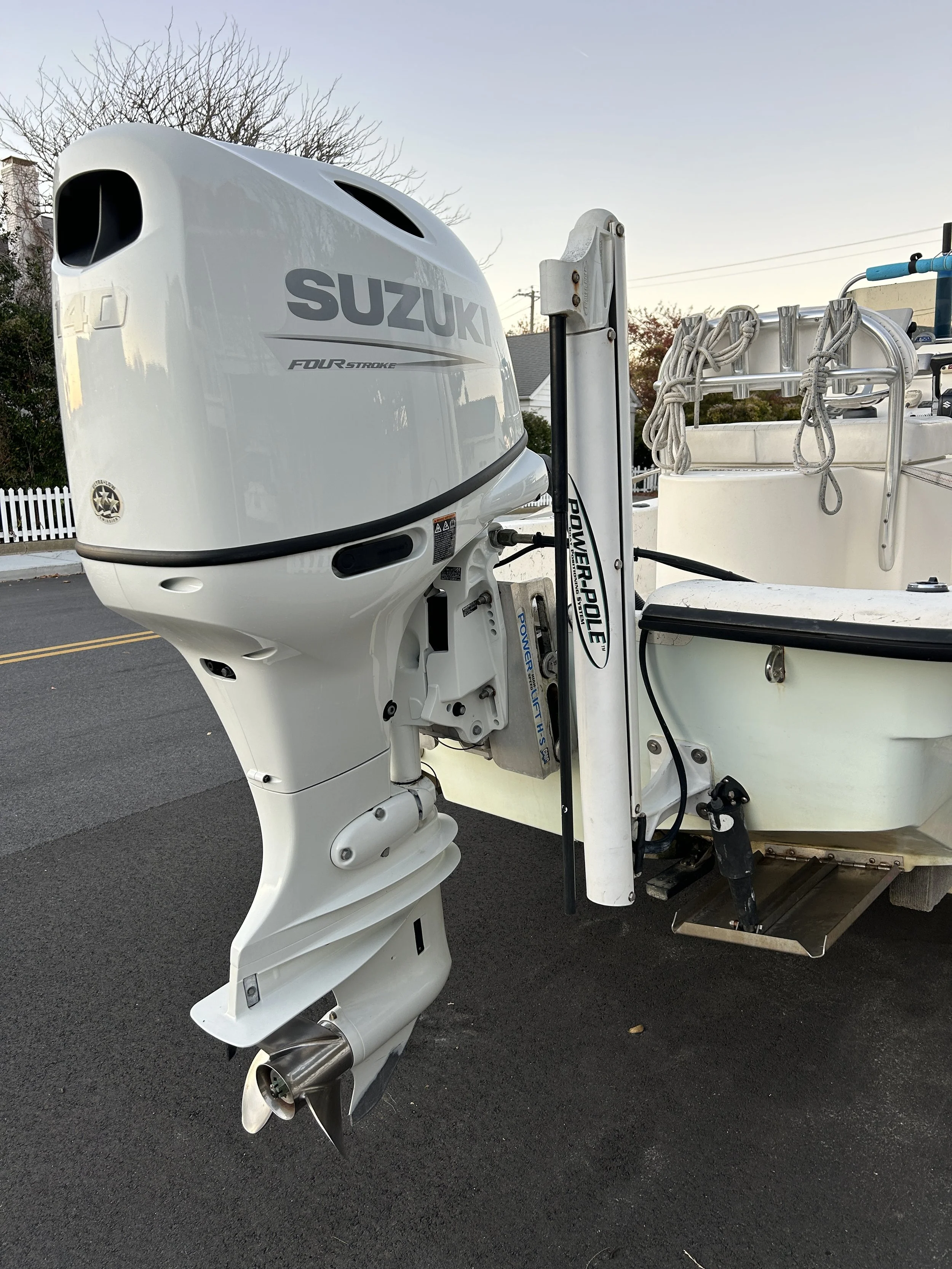 A Suzuki 140 hp., Power Pole, Jack Plate, and trim tabs on the Wedgie².