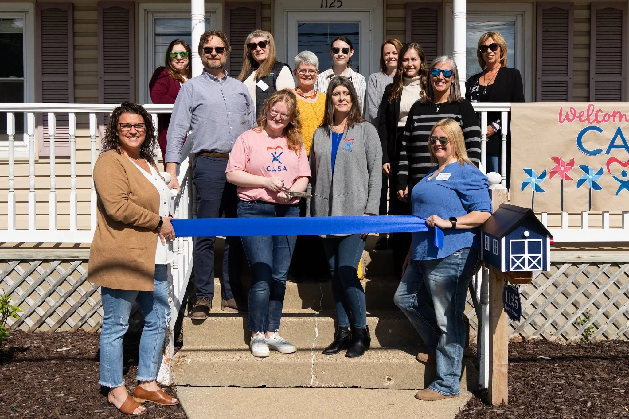 Chamber Ribbon Cutting at new Peru Location front porch