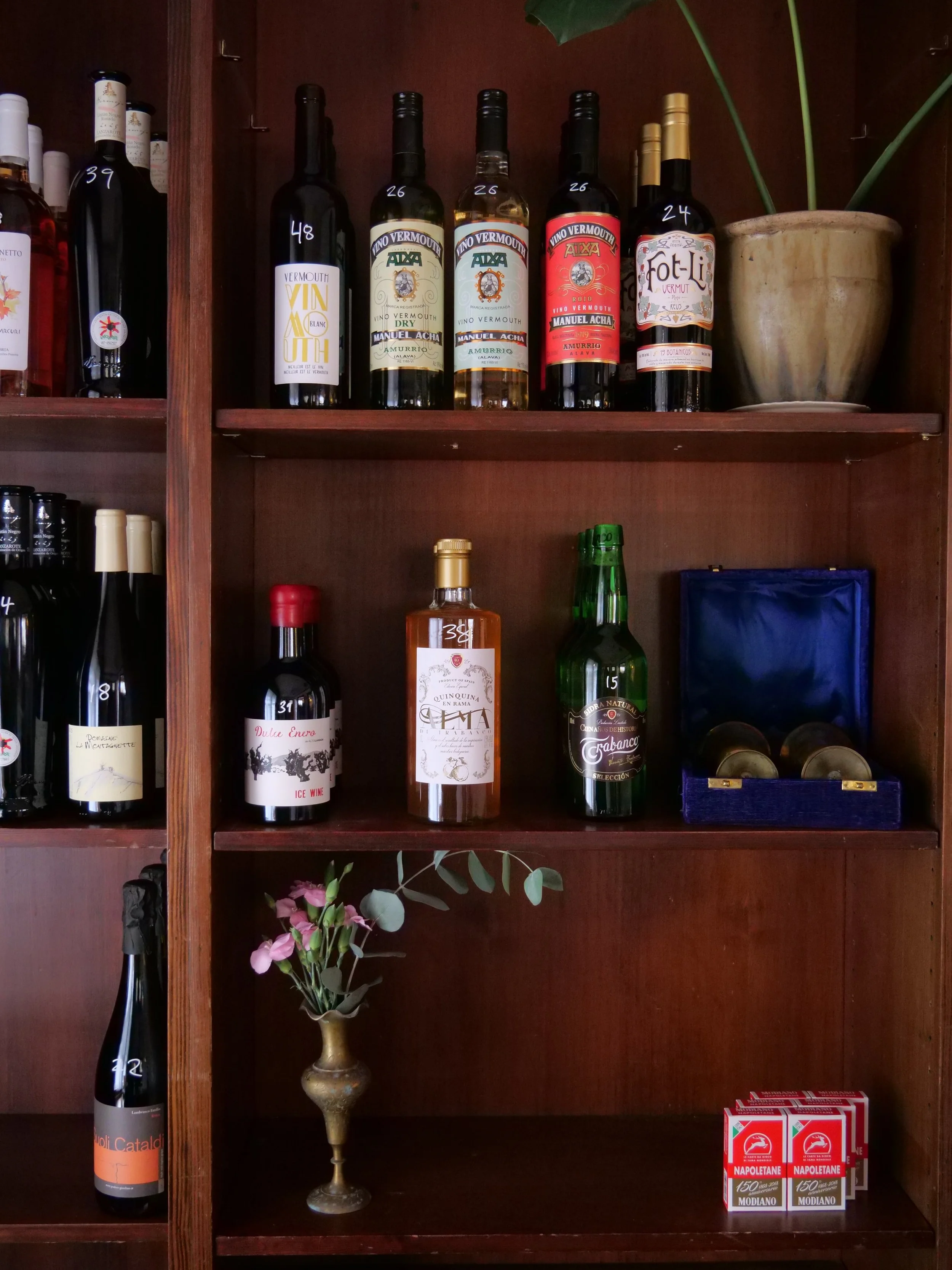 A bunch of our first orders came in today and it's very fun to see the shelves slowly start to fill up with some of my fave things: delicious wines and vermouths w beautiful labels + stories ... and, hell yah, some scopa card decks too 🥲