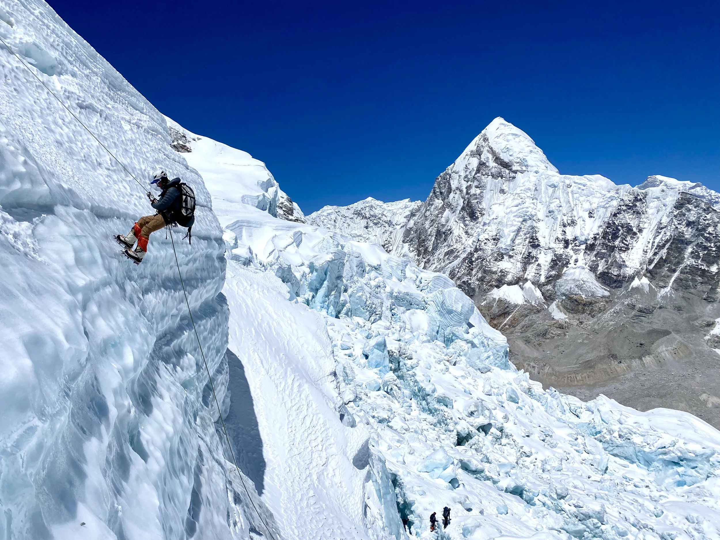 Dr. Jon Kedrowski rappels down a glacier high in the Himilaya.