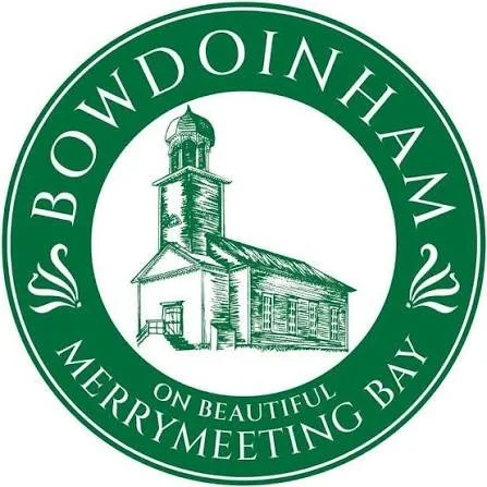 Green circular logo for Bowdoinham with a line drawing of a church, with text 'BOWDOINHAM ON BEAUTIFUL MERRYMEETING BAY' around the circle.