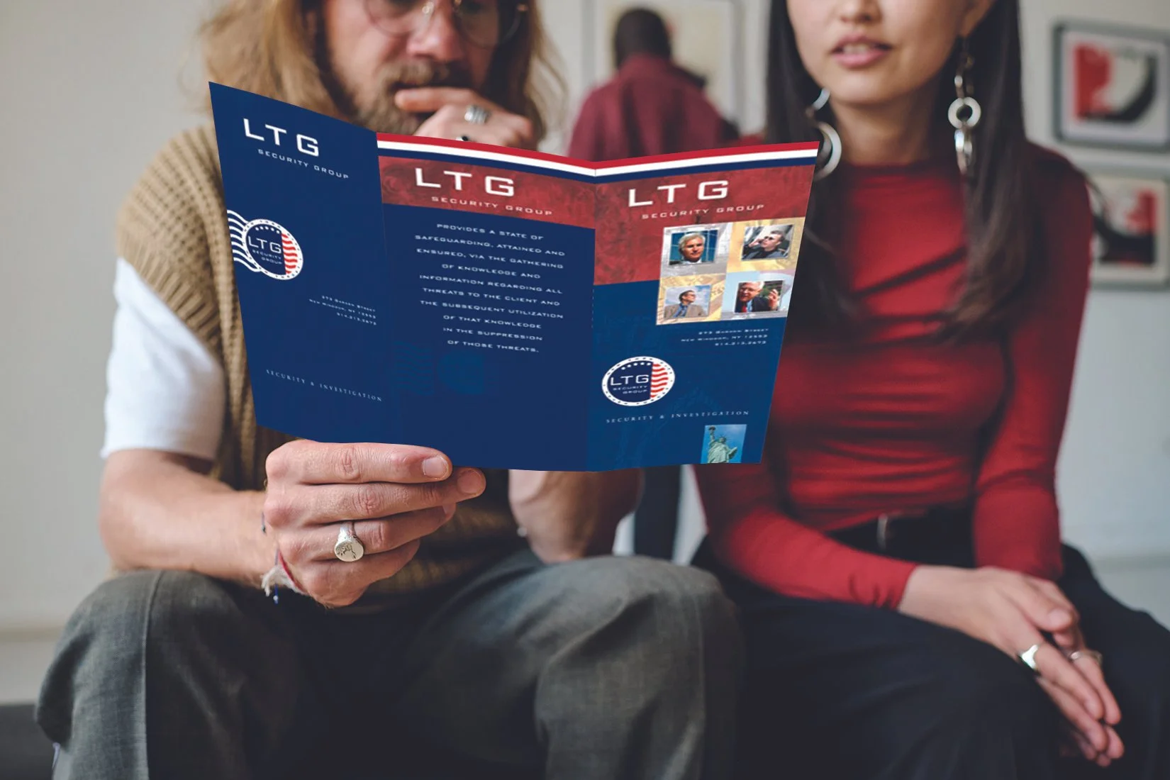 Couple Looking at Tri-Fold Flyer