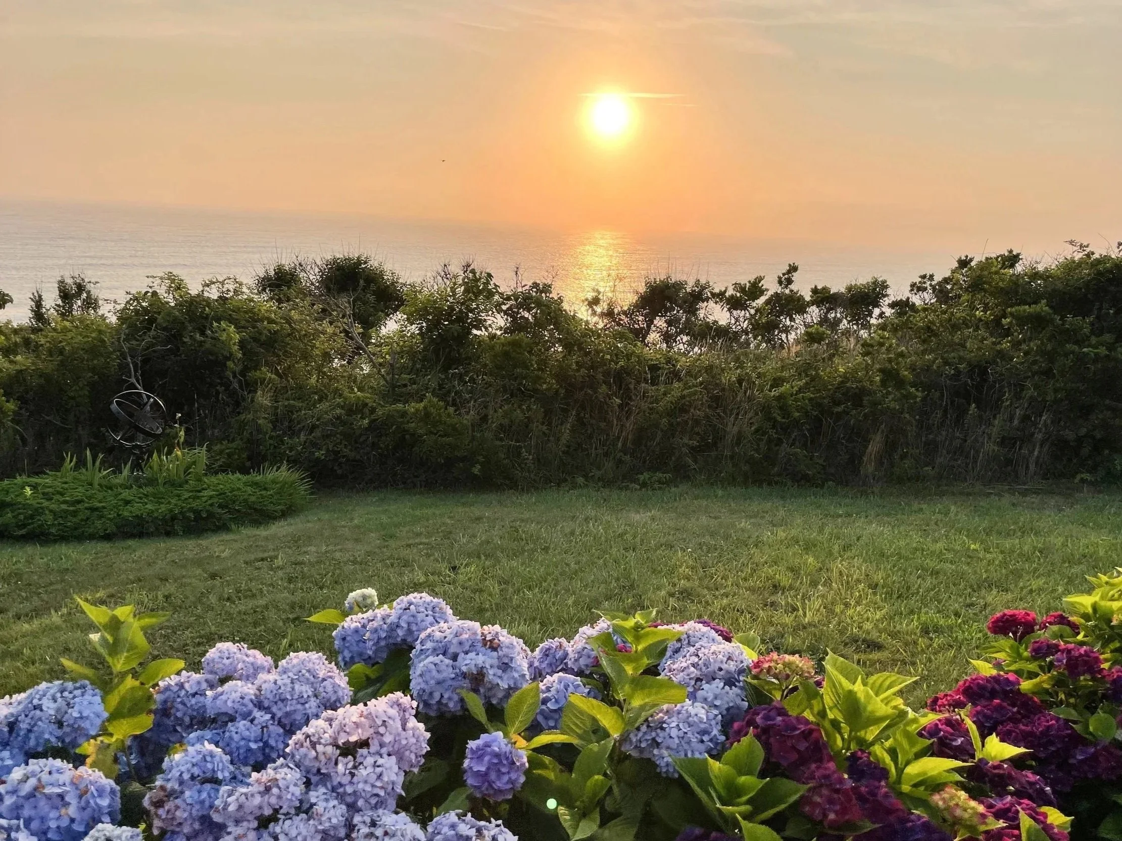 Coastal sunset over Duxbury Bay reflecting the calm, thoughtful, and personalized approach of Snug Harbor Home Care.