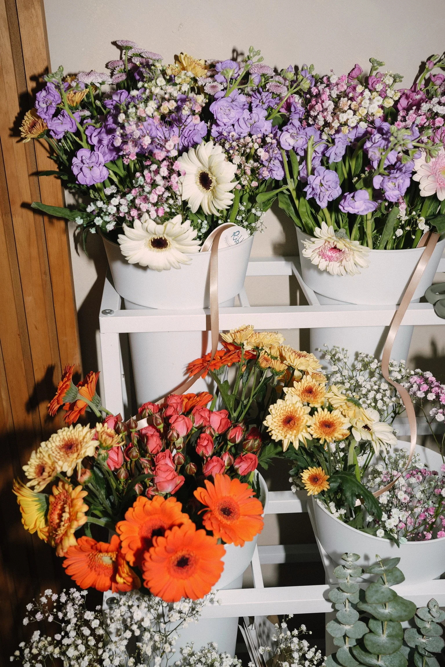 Fresh flower arrangements at a private event at Revive Chiropractic, San Diego