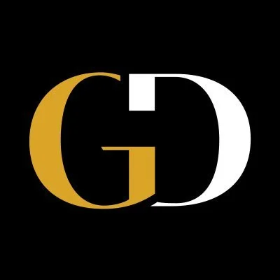 Design with the letters G and D, with G in gold and D in white on a black background.