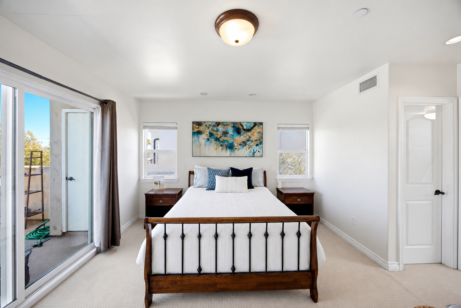 Neatly Staged Neutral Bedroom.png