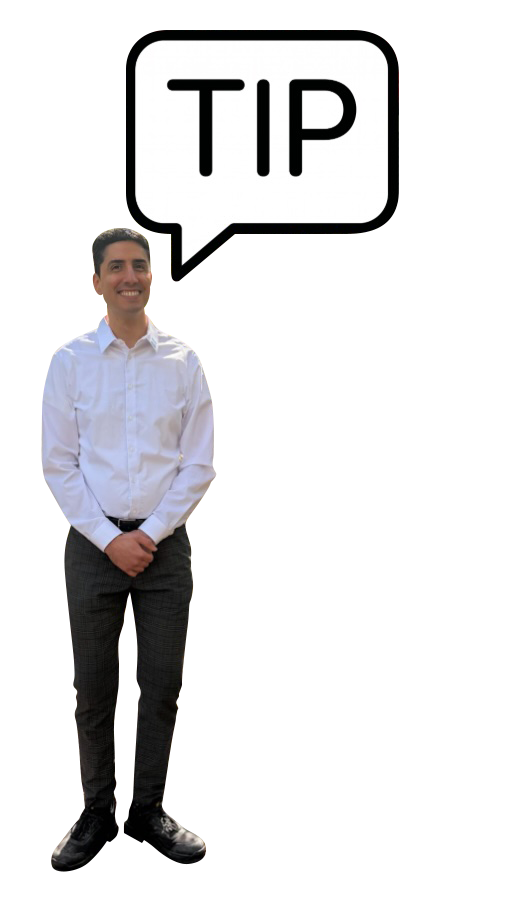 A man in a white dress shirt and dark pants standing next to a tall sign with a speech bubble that says 'TIP'.