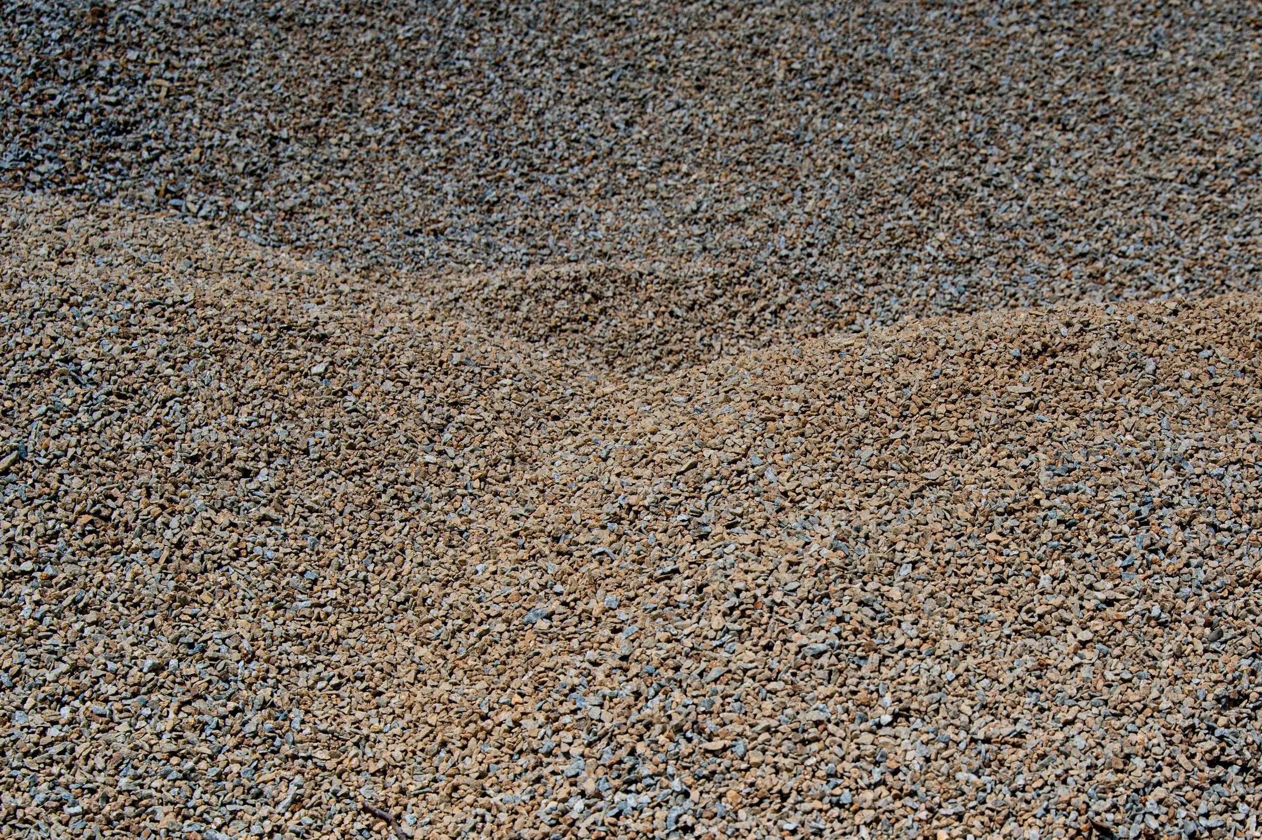 Close-up of gravel or small stones on the ground.