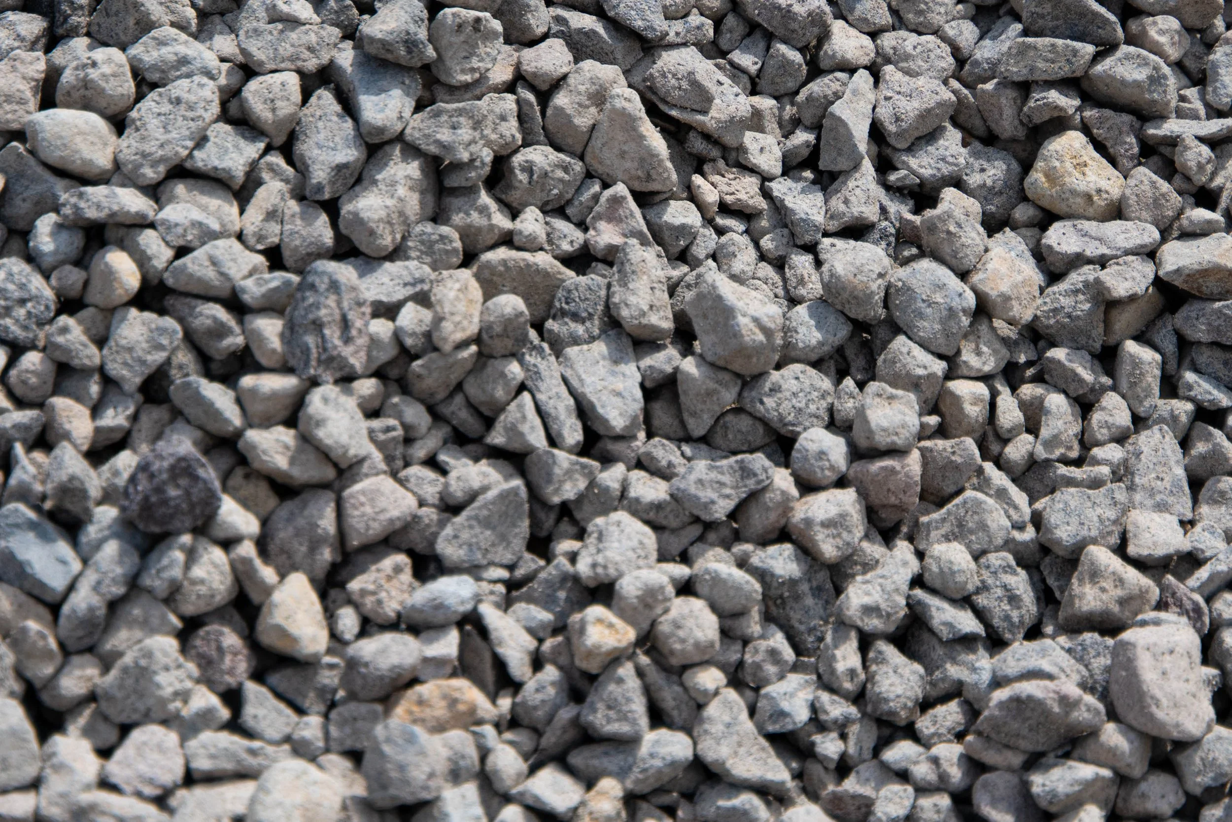 Close-up of small gray gravel stones piled together.