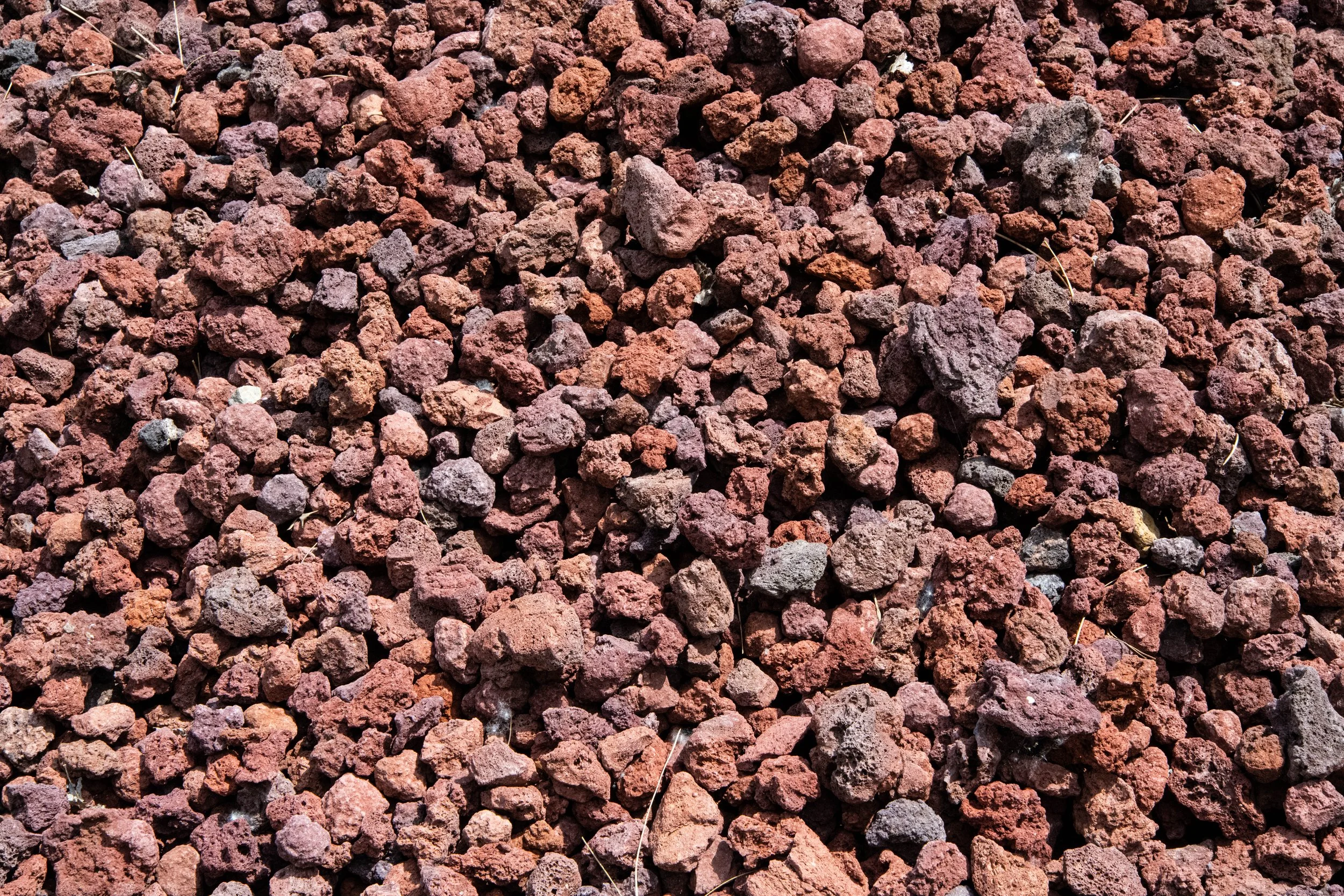 Close-up of reddish-brown gravel stones.