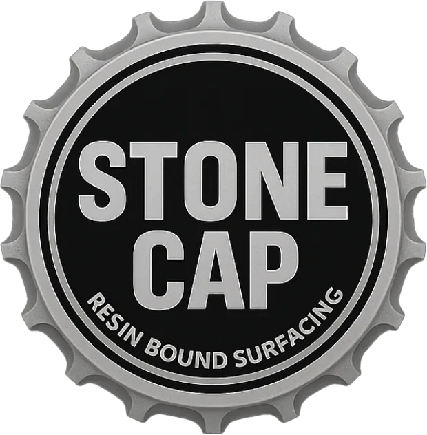 A black and gray logo resembling a bottle cap with the words "Stone Cap" in bold font and "Resin Bound Surfacing" in smaller font around the bottom edge.