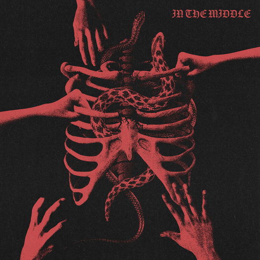 Illustration of a human ribcage with multiple hands reaching towards it, with snakes intertwined around the ribs, and the text 'In The Middle' in the top right corner. The image uses a red and black color scheme.