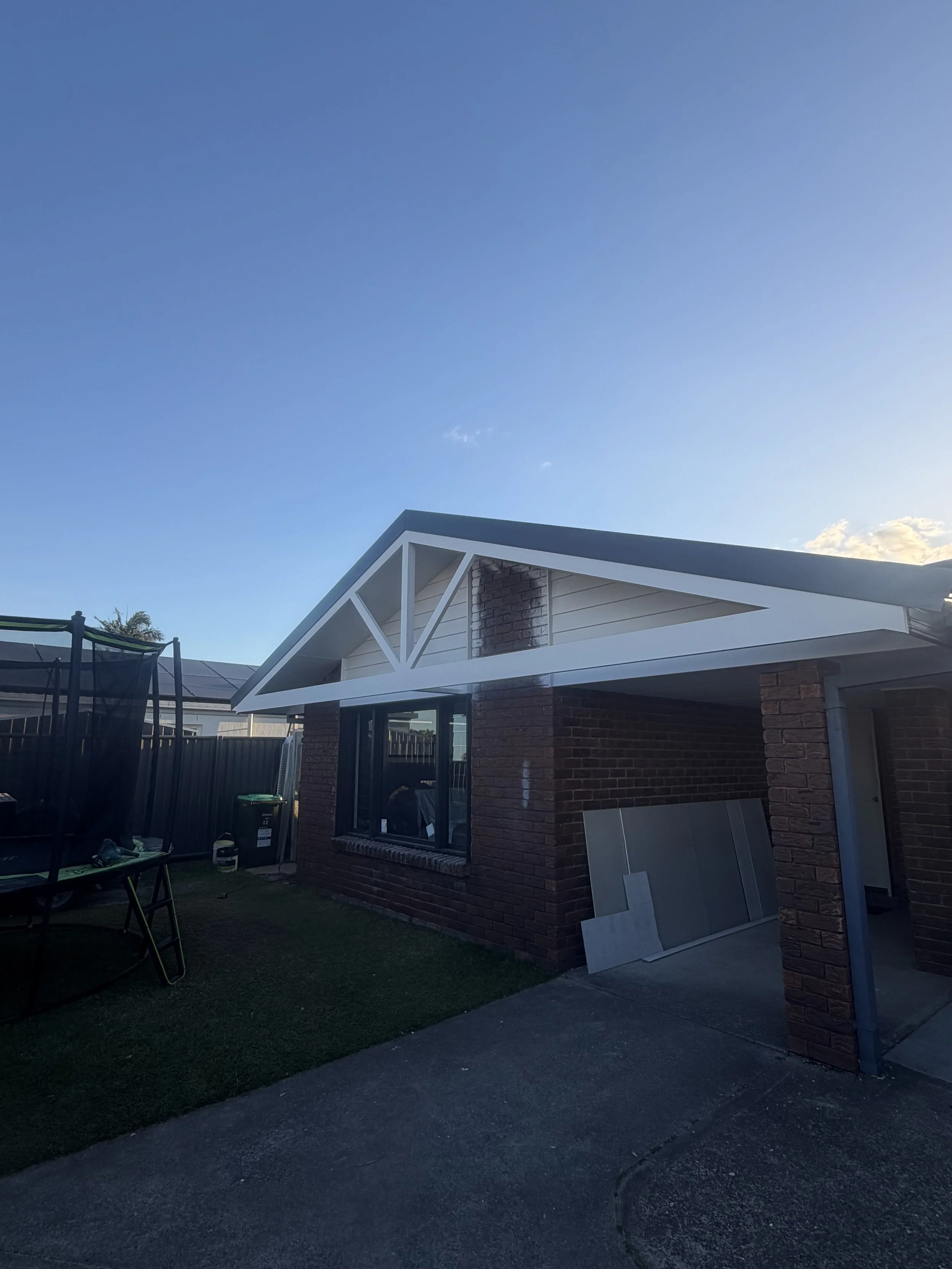 Roof extension with a feature truss. reno in Varsity Lakes