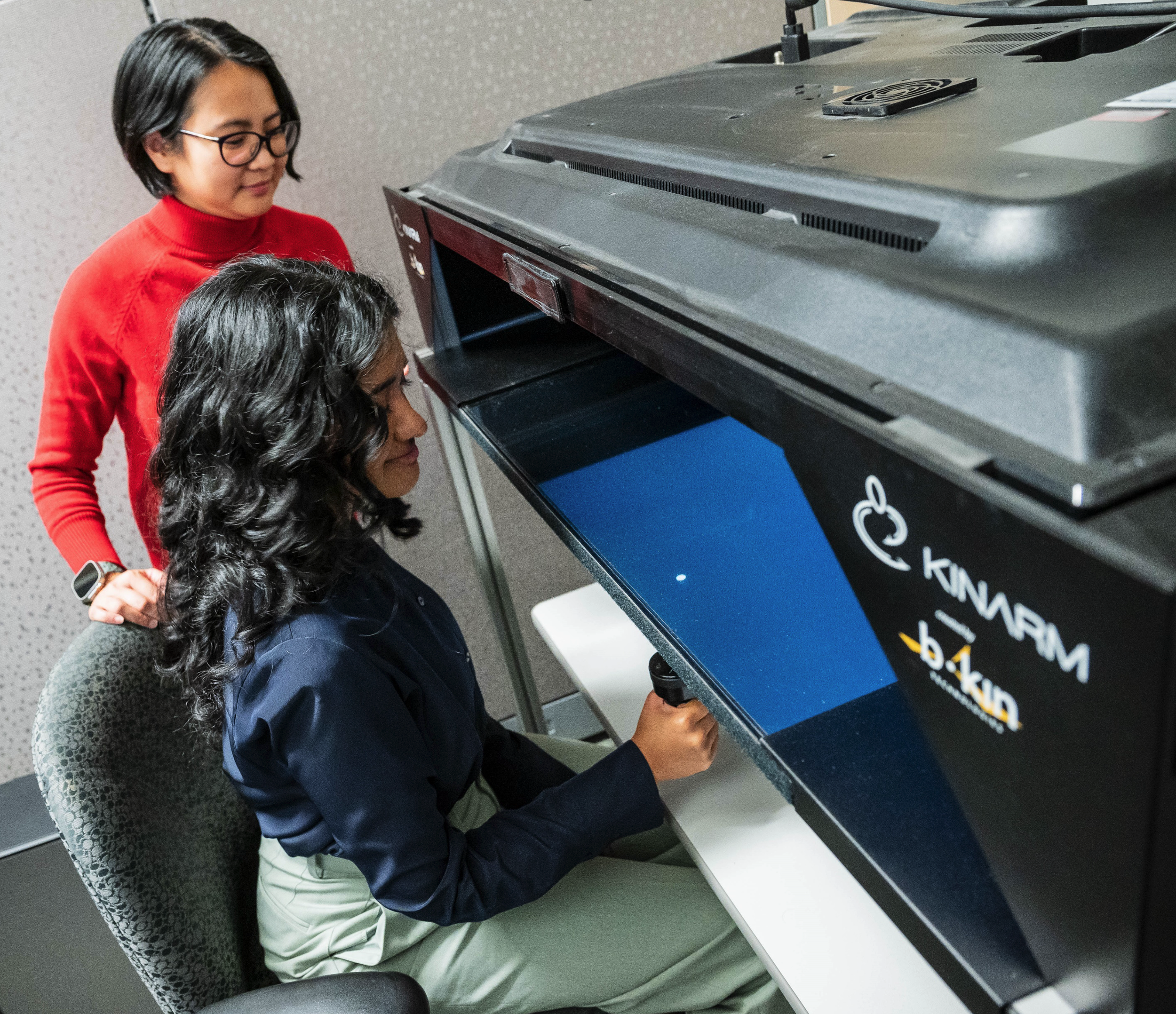 Two researchers in Miriam Spering's UBC Lab.
