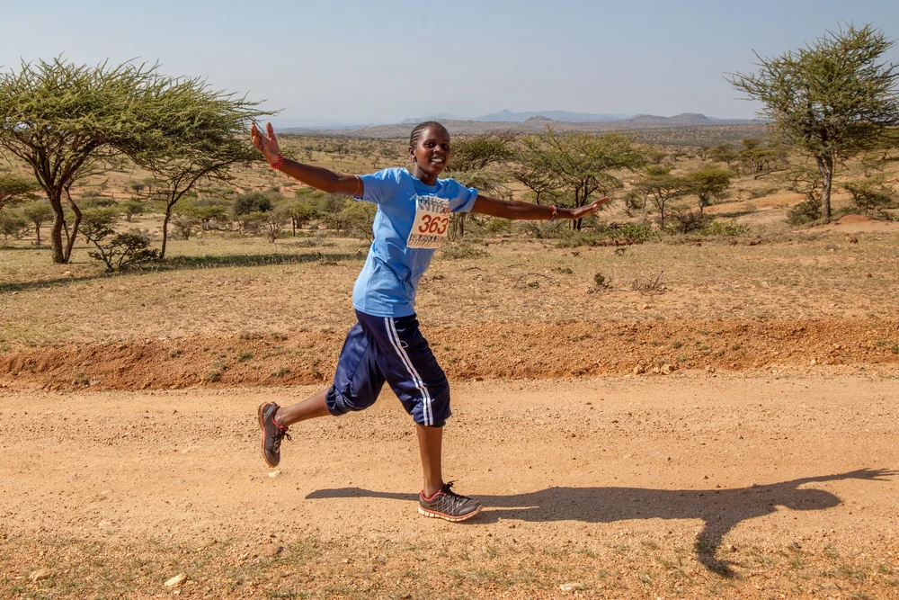 A runner celebrating out on the course