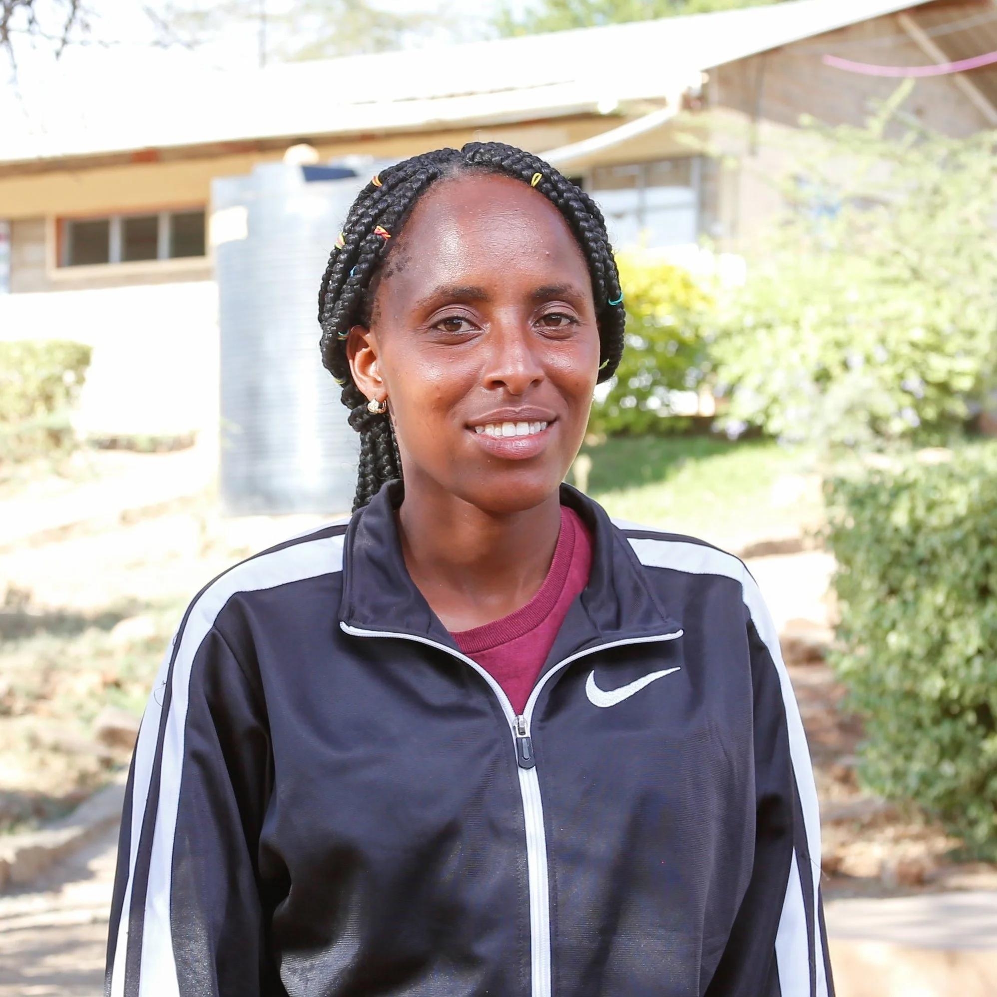 Coach Triza | Triza is a determined person when it comes to the work given. She likes being herself and socializing with positive people.

Triza is from Laikipia county, from a humble family. Her family is very happy since she joined  the athletic cl