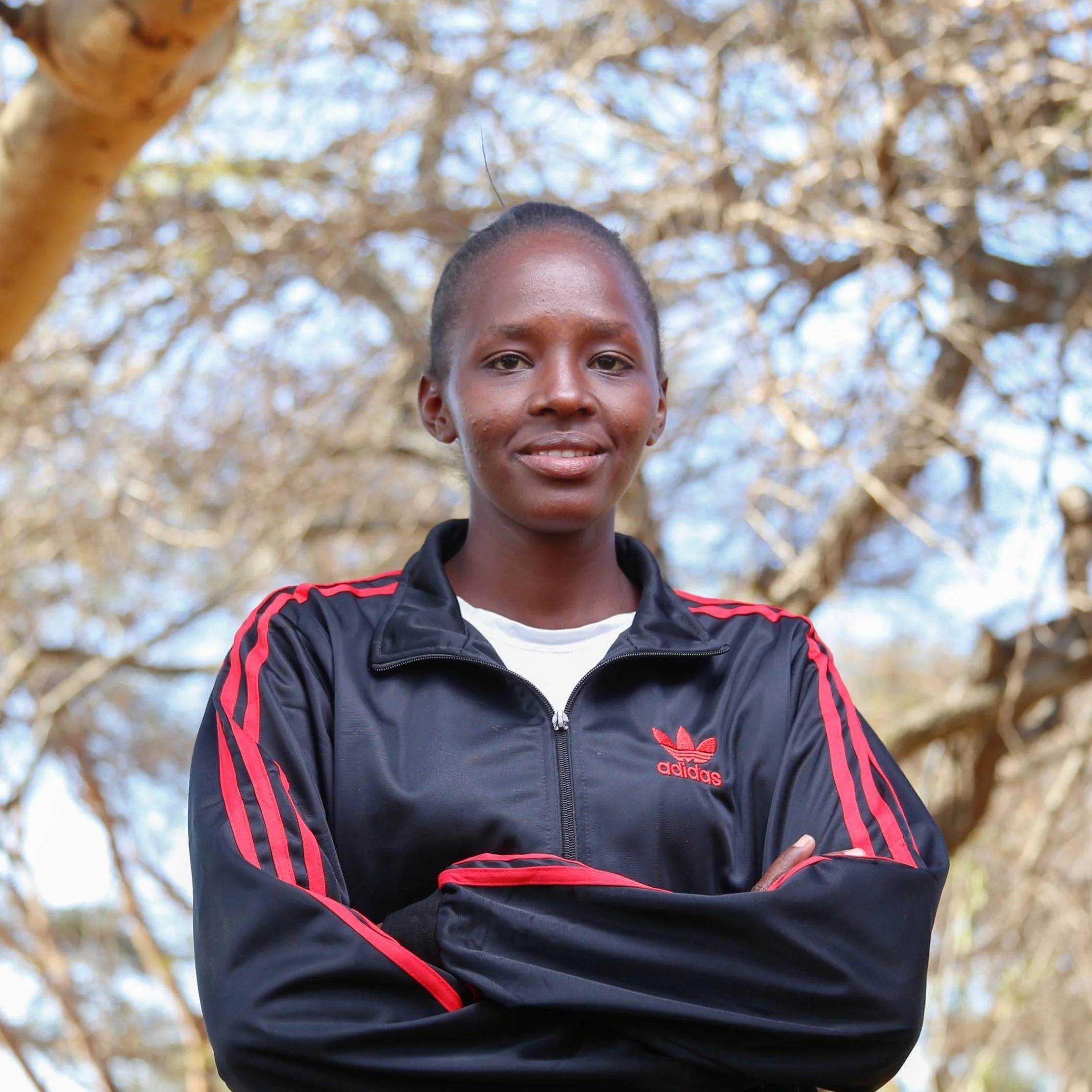 Coach Lilian |

Lilian Meisinai Pere is a graduate of the Amazing Maasai Girls Project scholarship fund. She was brought up  in a disadvantaged family where her mother was the only bread winner.  Lilian enjoys running and coaching - especially intera