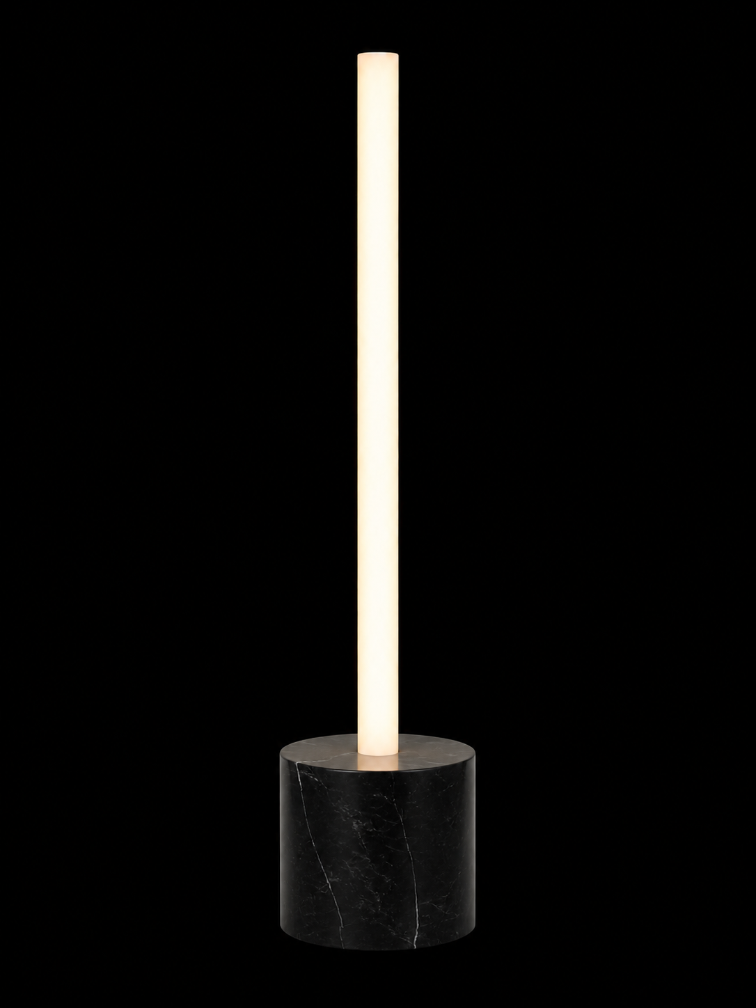Eldon Trace Column lamp in black marble, a warm white lit column on a 5 inch black marble drum base