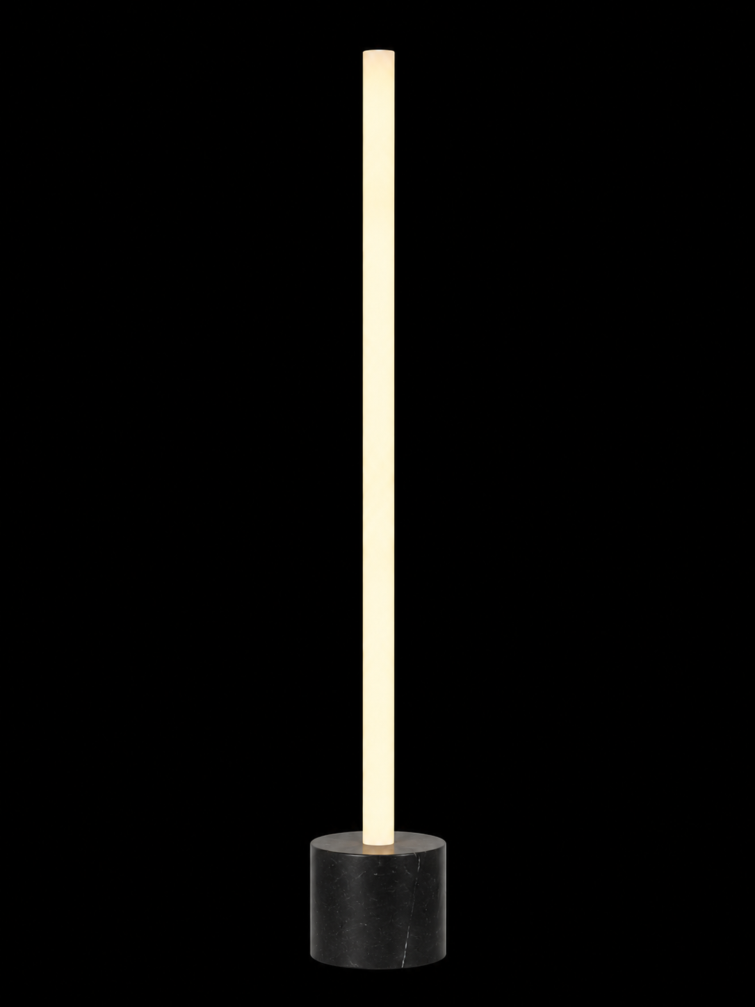 Eldon Trace Column lamp in black marble, a warm white lit column on a 5 inch black marble drum base