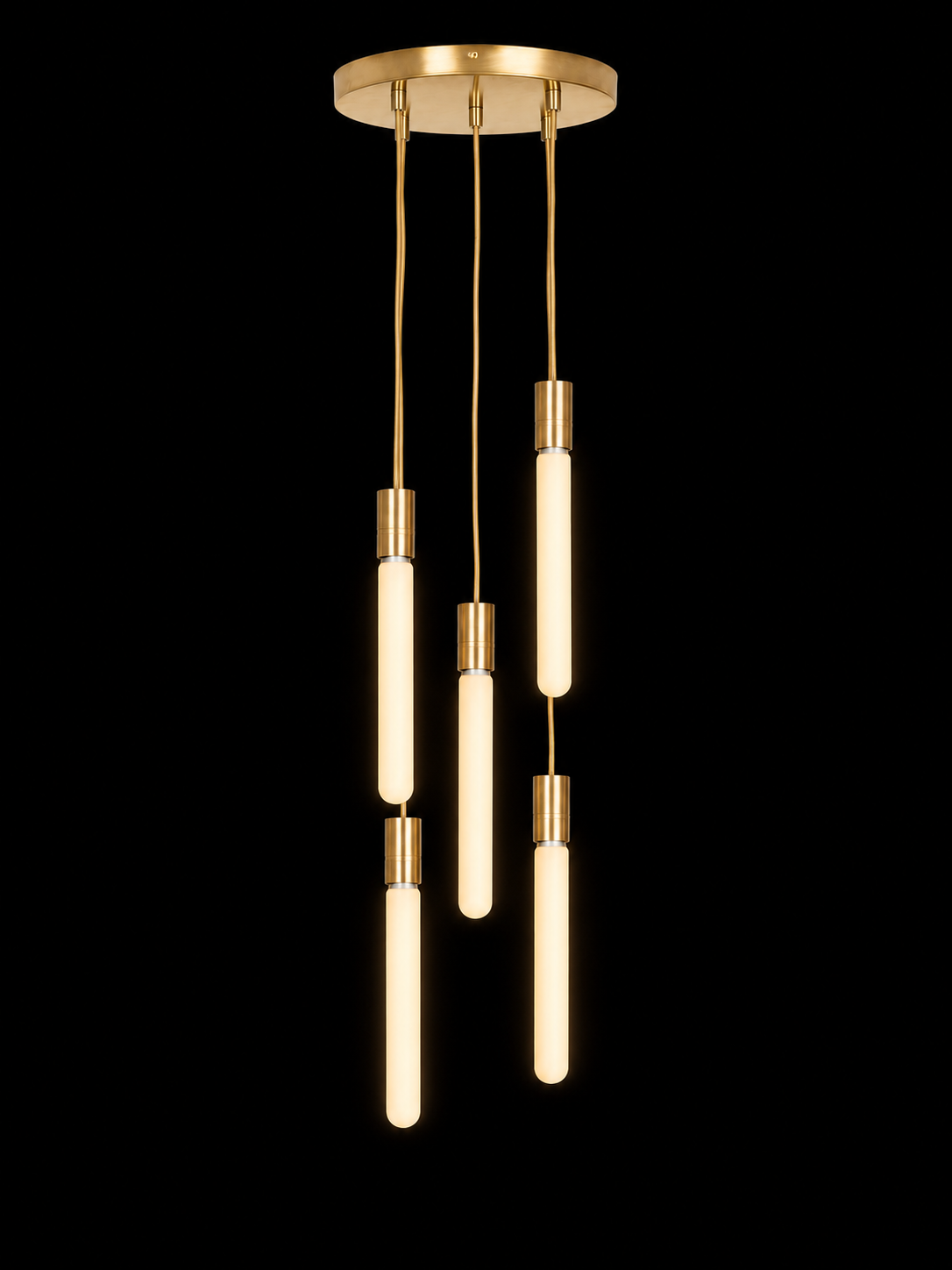 Eldon Trace Halo chandelier in brass, warm white lit drops staggered from a round brass ceiling canopy.