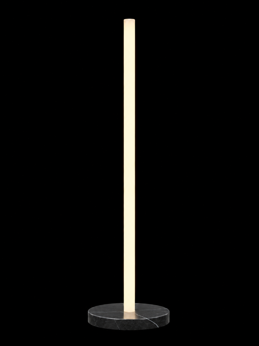 Eldon Trace Column lamp in black marble, a warm white lit column on a round black marble disc base.