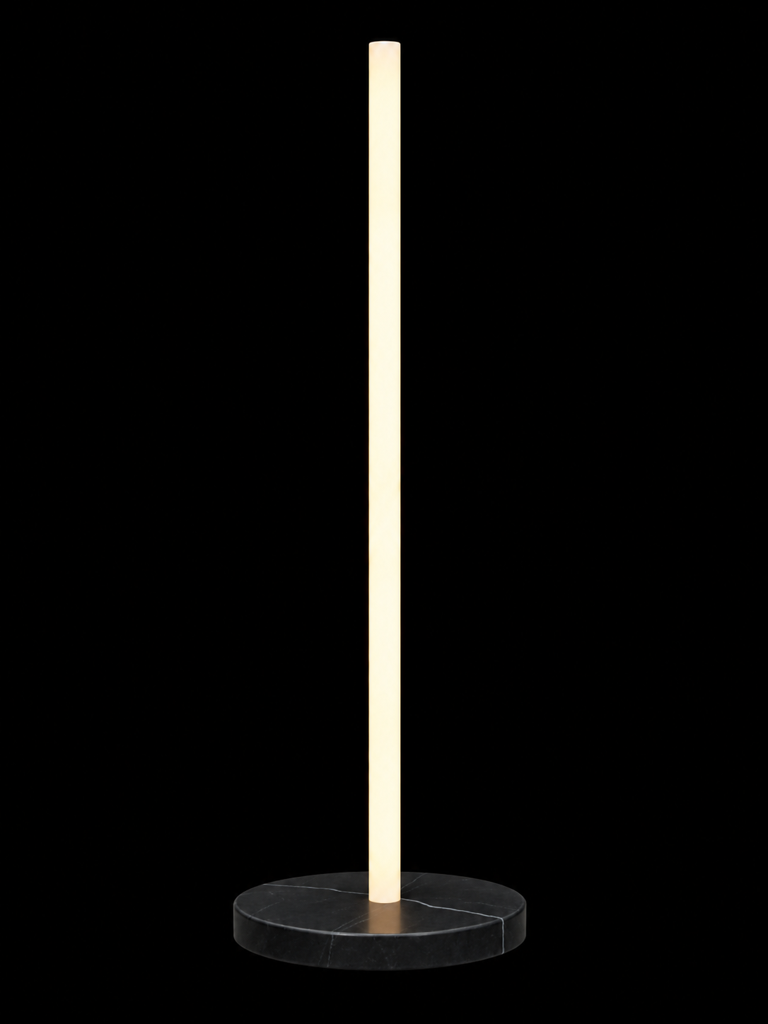 Eldon Trace Column lamp in black marble, a warm white lit column on a round black marble disc base.