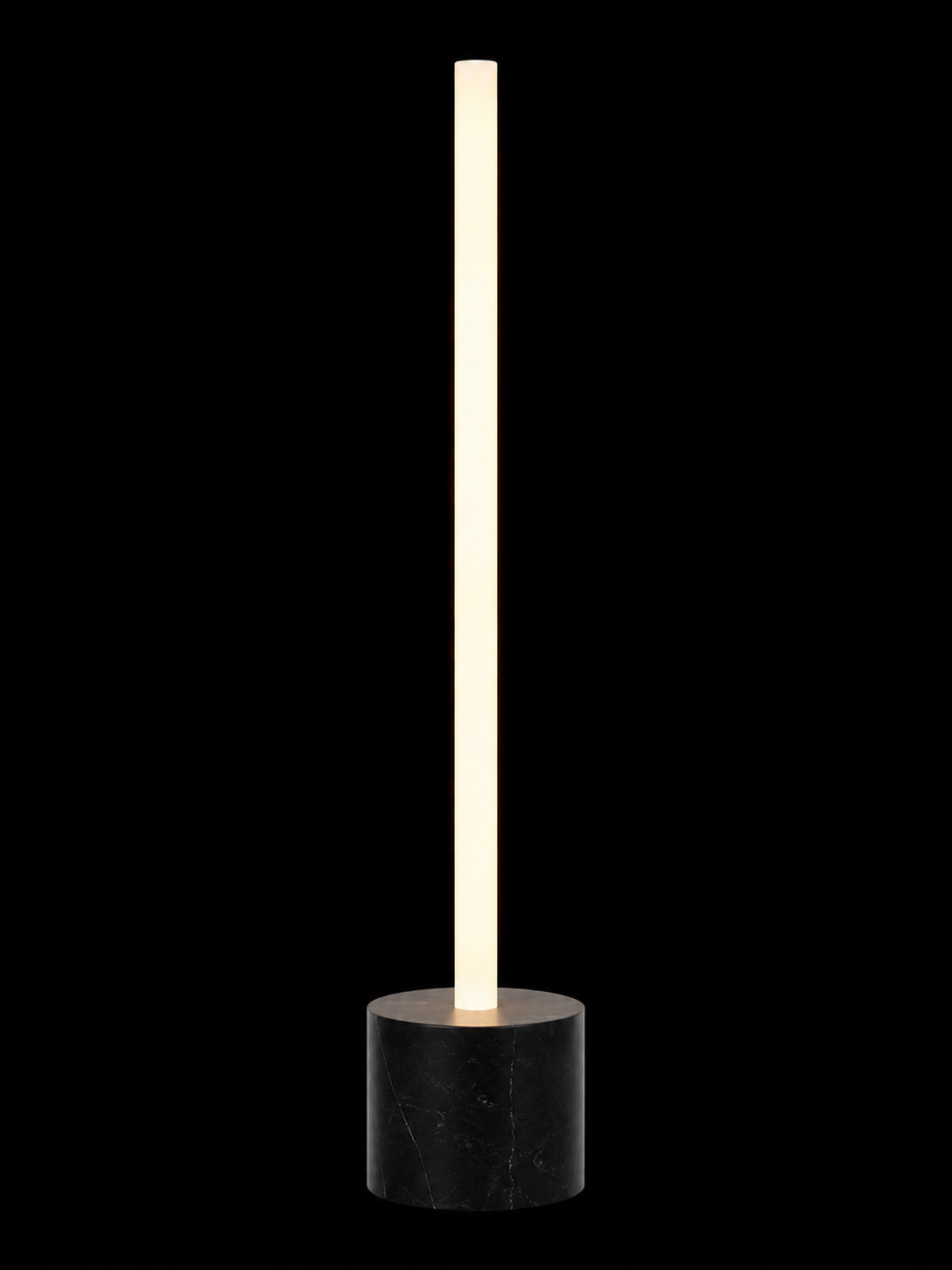 Eldon Trace Column lamp in black marble, a warm white lit column on a 5 inch black marble drum base