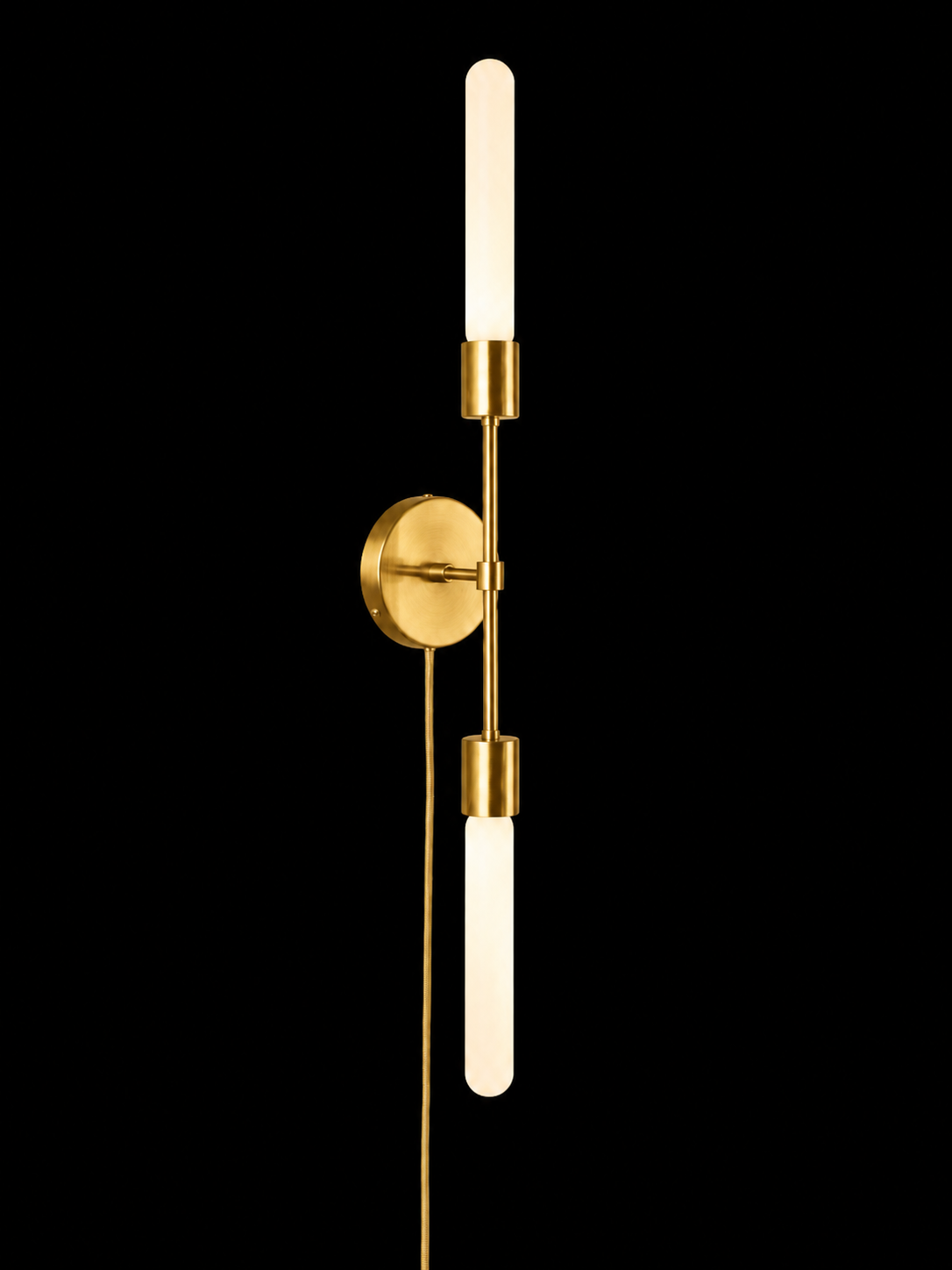 Eldon Trace Plus One double sconce in brass, two bare bulbs on a slim arm with a round wall canopy and plug-in cord