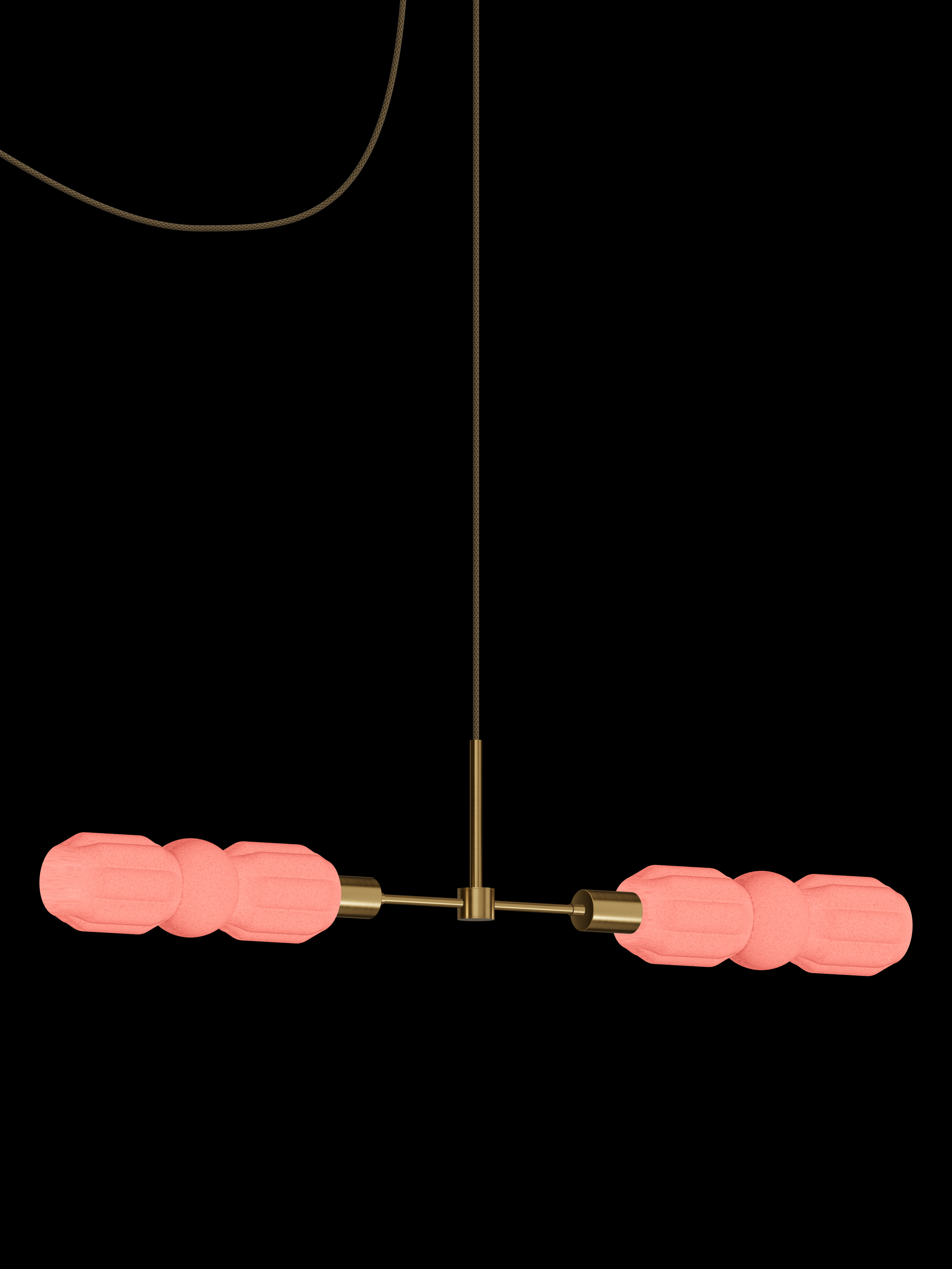 Elaine Eavesdropper horizontal pendant with shapes glowing coral pink and brass hardware; plug-in version.