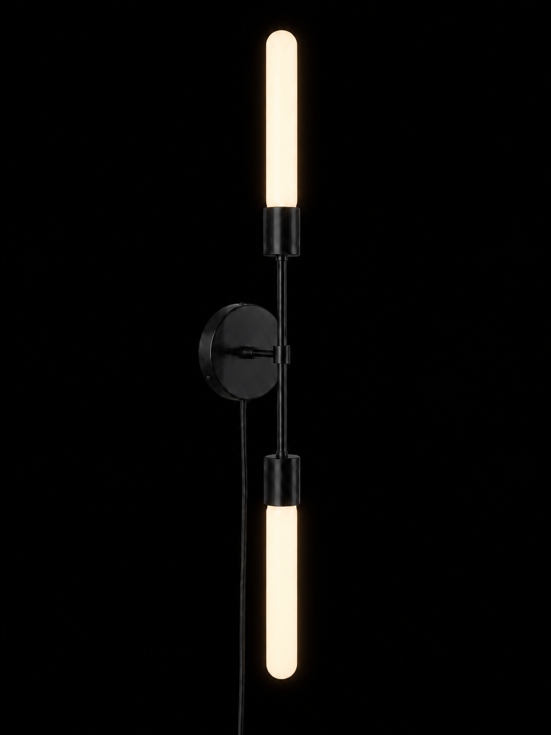 Eldon Trace Plus One double sconce in black, two bare bulbs on a slim arm with a round wall canopy and plug-in cord