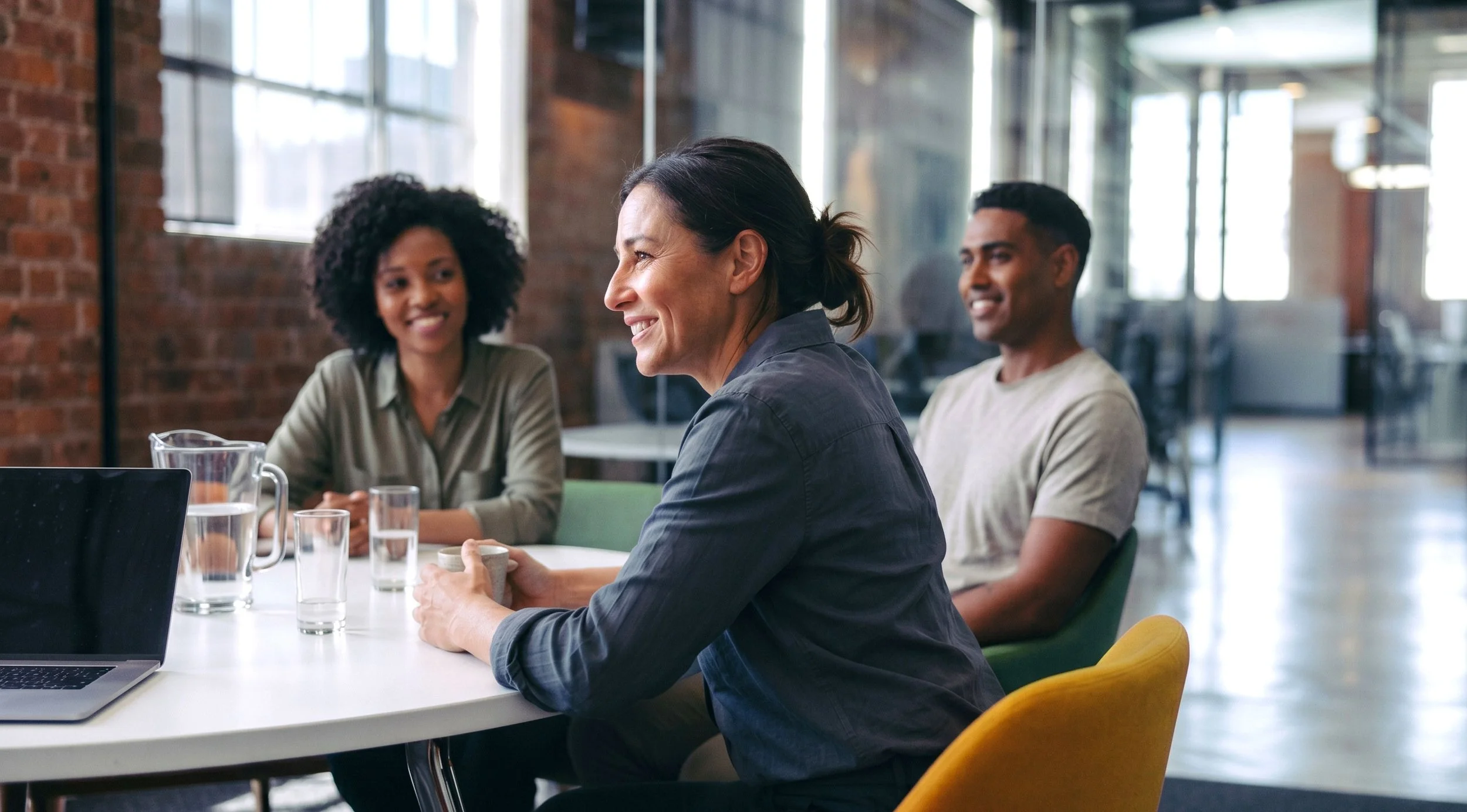 A diverse team collaborating in a modern office, reflecting Growth Mode's commitment to diverse and high-impact hiring for fast-growing tech startups.