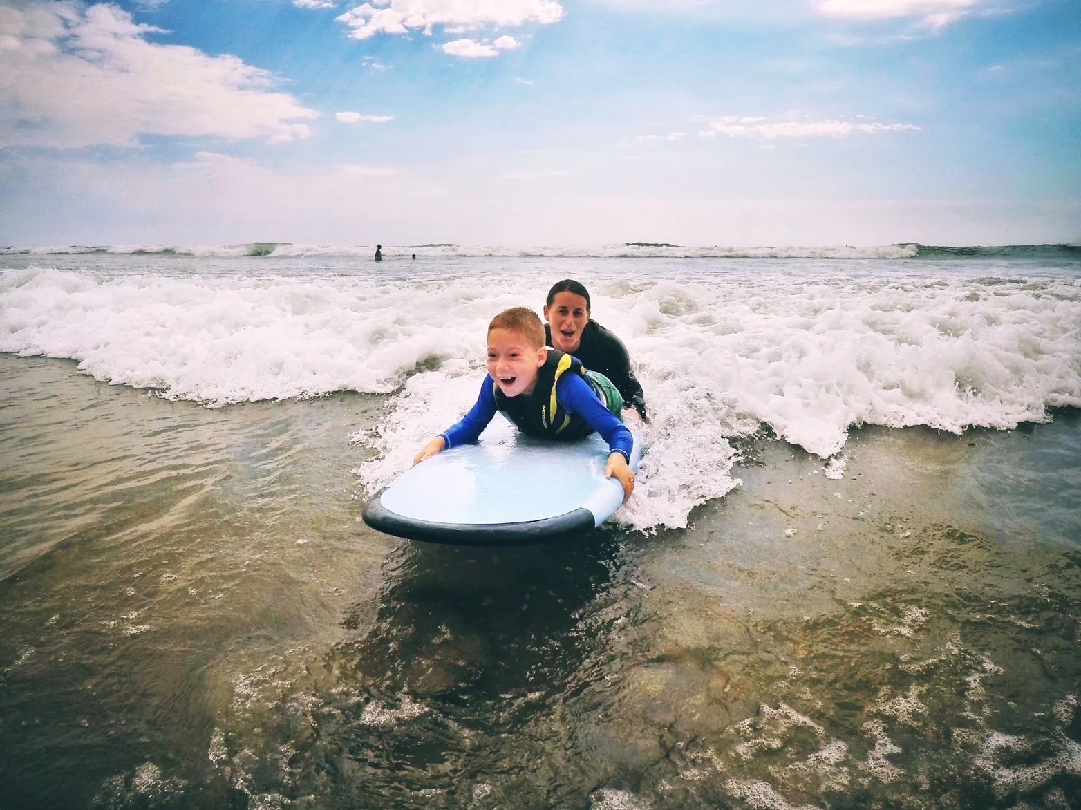 Sada and her son surfing