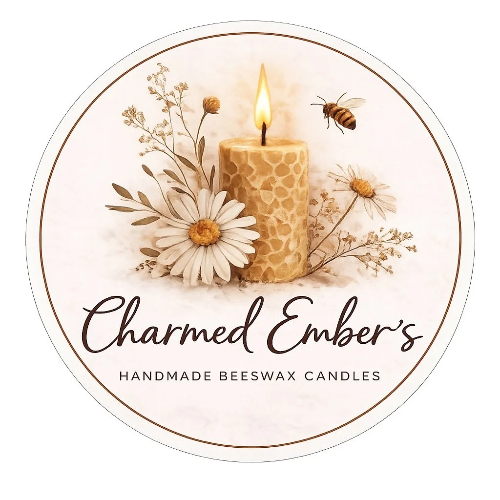 A round label featuring a lit beeswax candle surrounded by daisies and other flowers, with a bee flying near the candle, and text that reads "Charmed Ember's Handmade Beeswax Candles".