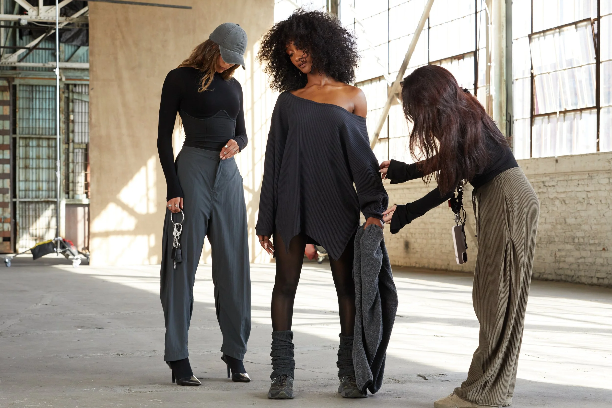 Joah-Brown-Ecomm-Behind-The-Scenes-On-Set-Off-Shoulder-Tunic-Midnight-Luxe-Knit-Split-Hem-Legging-Black-Mesh-Leg-Warmers-Ink-Luxe-Knit-Corset-Long-Sleeve-Vintage-Black-FlexRib-Barrel-Pant-Jet-The-Official-Cap-Washed-Black-498.jpg
