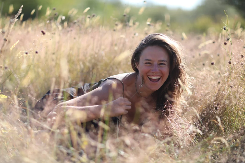 Flowa Grace resting in a meadow